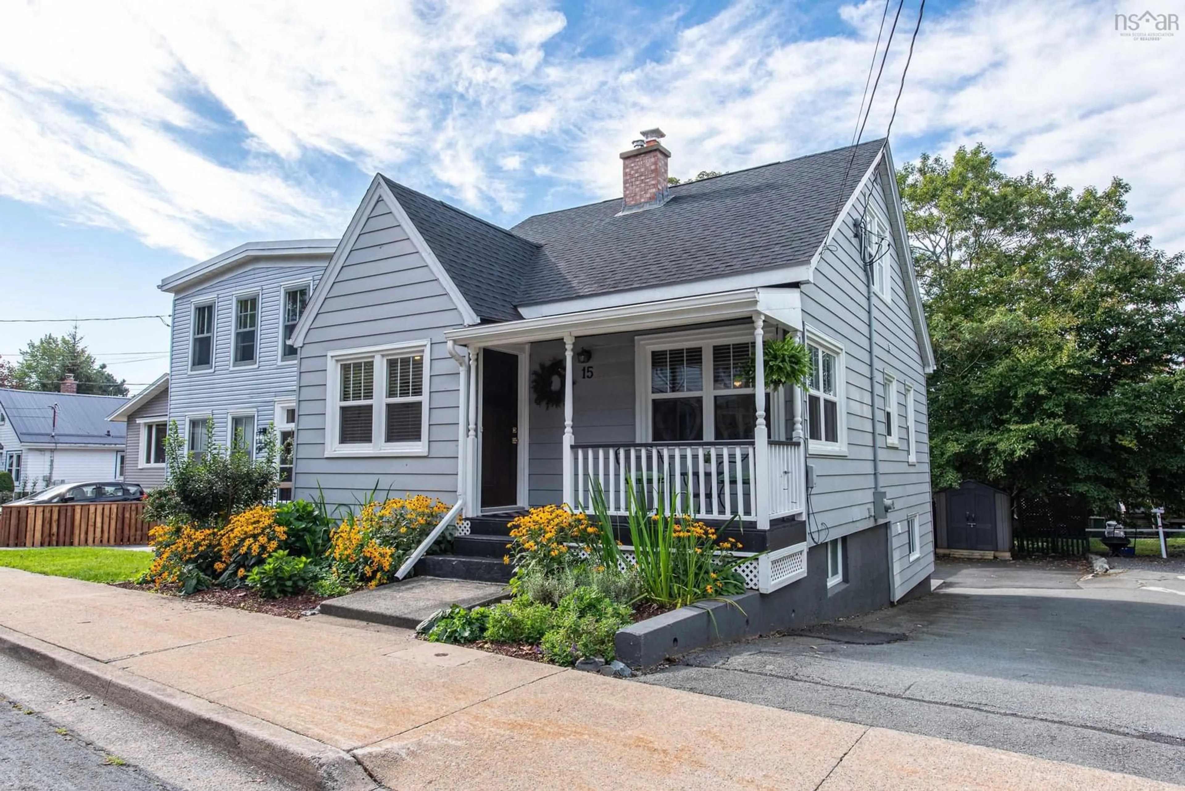 Home with vinyl exterior material, street for 15 Hester St, Dartmouth Nova Scotia B3A 1K3