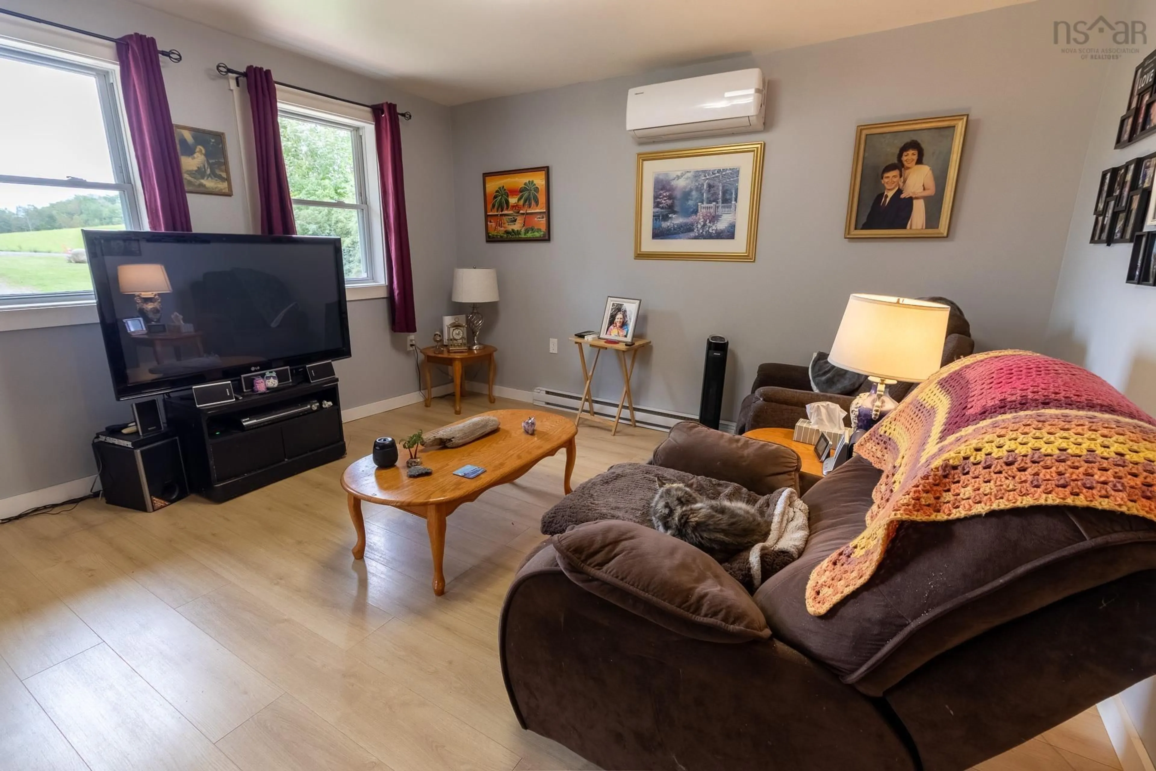 Living room with furniture, wood/laminate floor for Buchanan Rd #178, South Berwick Nova Scotia B0P 1E0