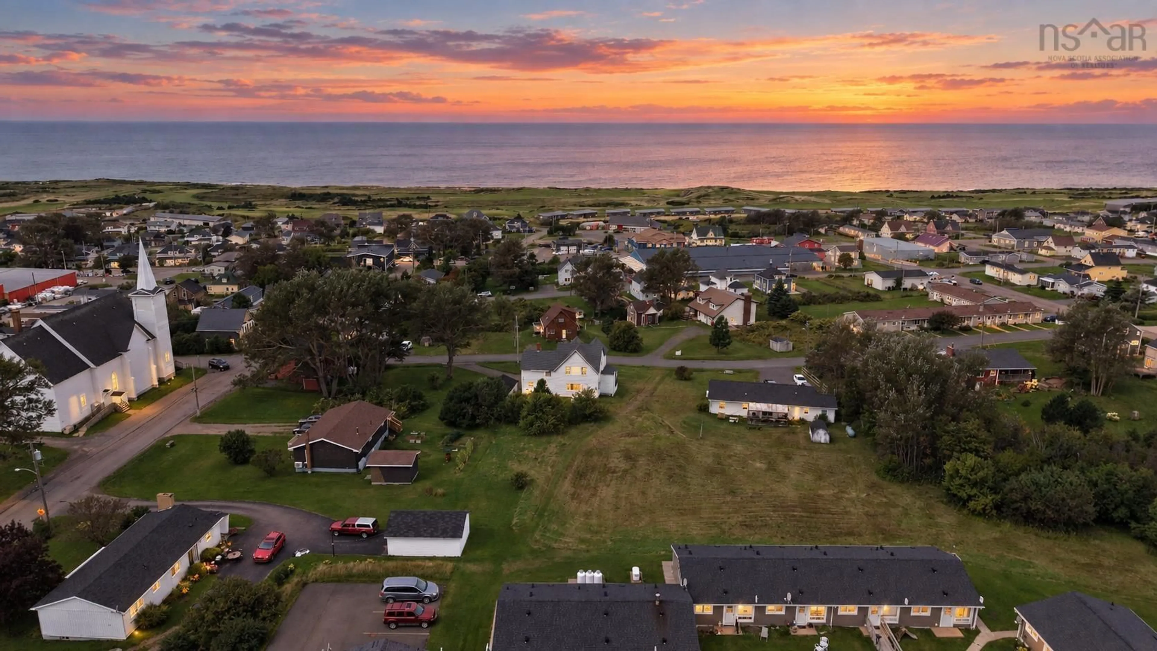 A pic from outside/outdoor area/front of a property/back of a property/a pic from drone, water/lake/river/ocean view for 88 Church St, Inverness Nova Scotia B0E 1N0
