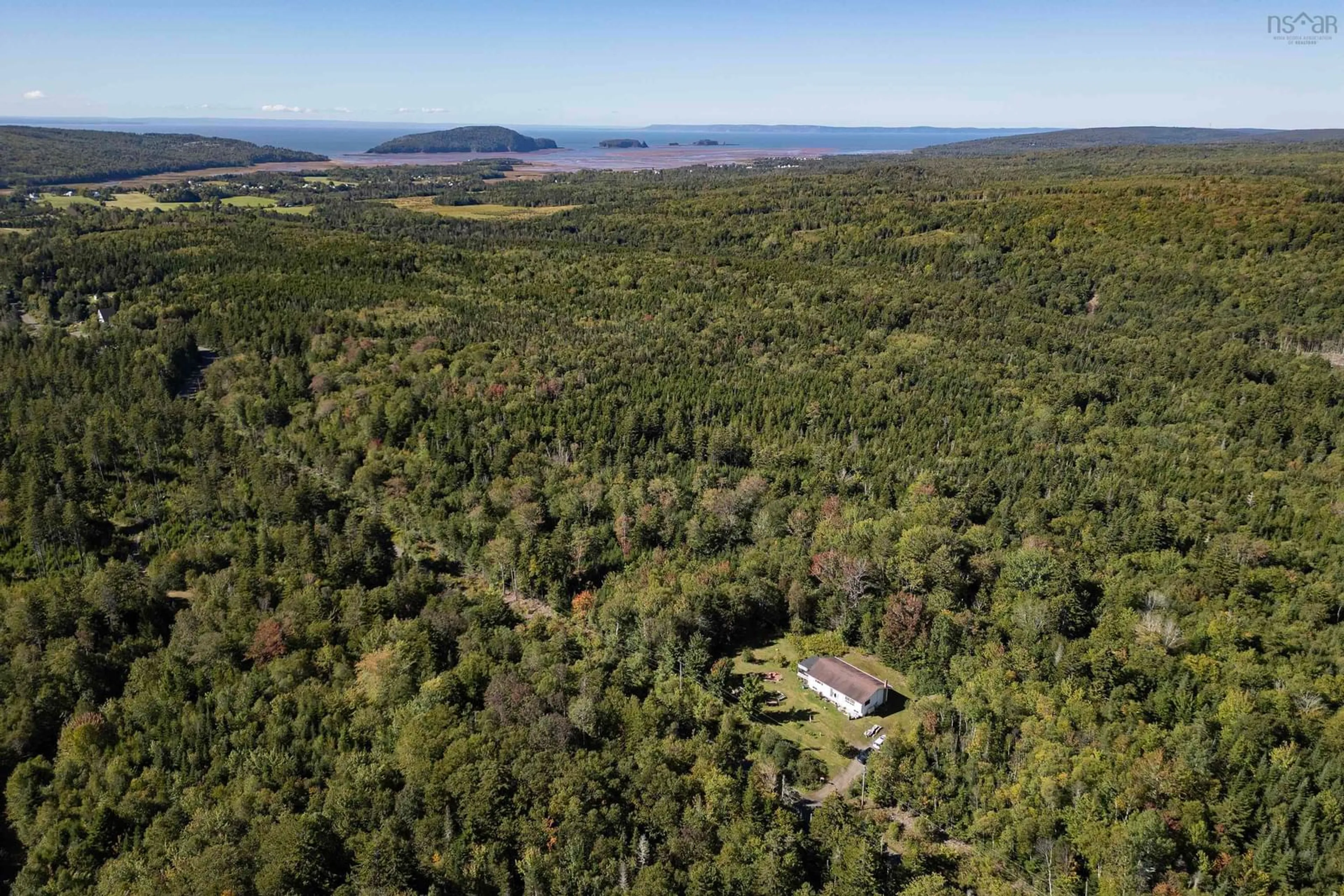 A pic from outside/outdoor area/front of a property/back of a property/a pic from drone, forest/trees view for 429 New Brittain Rd, Five Islands Nova Scotia B0M 1K0