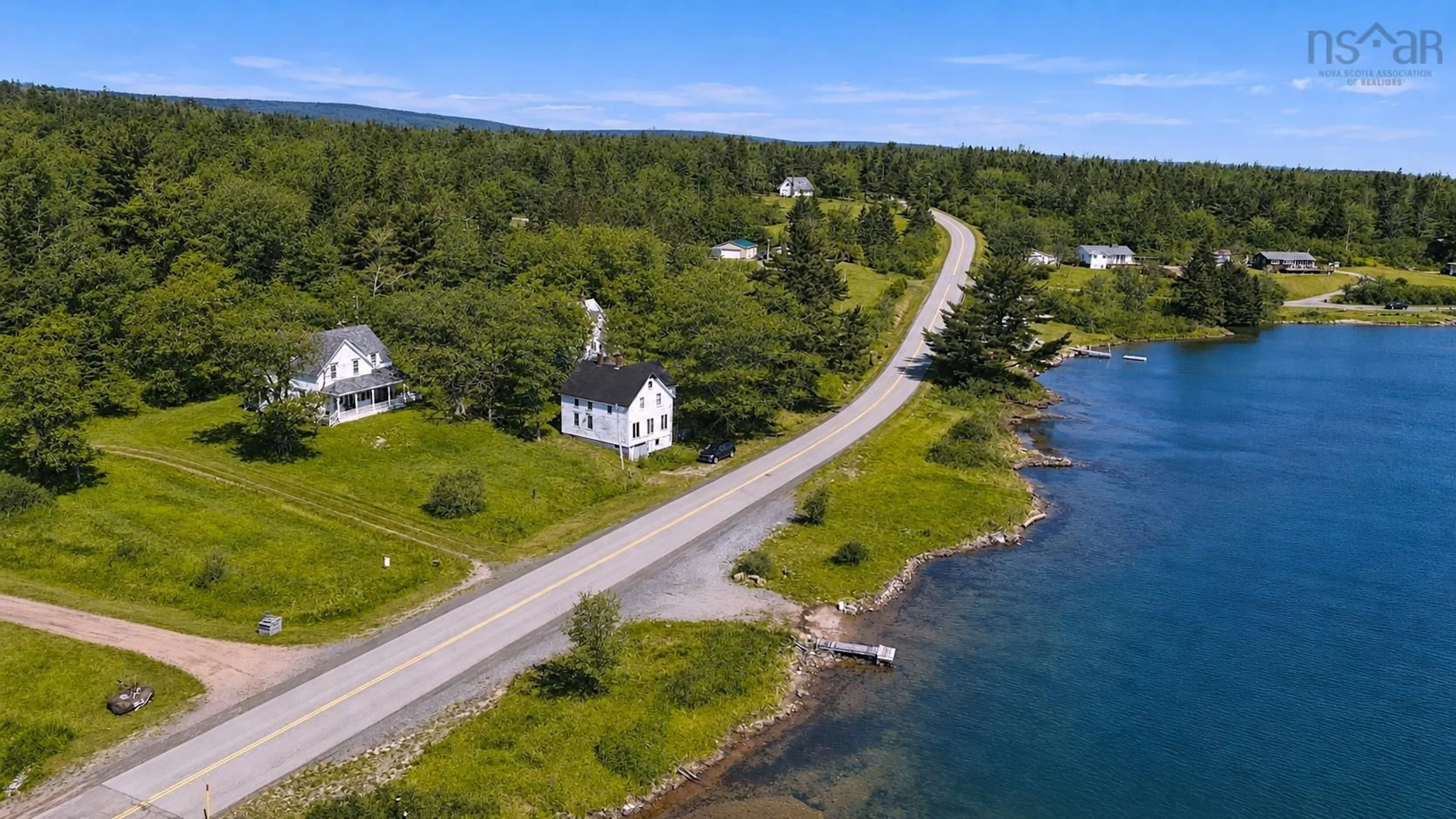 A pic from outside/outdoor area/front of a property/back of a property/a pic from drone, water/lake/river/ocean view for 2145 Marble Mountain Rd, West Bay Nova Scotia B0E 3K0