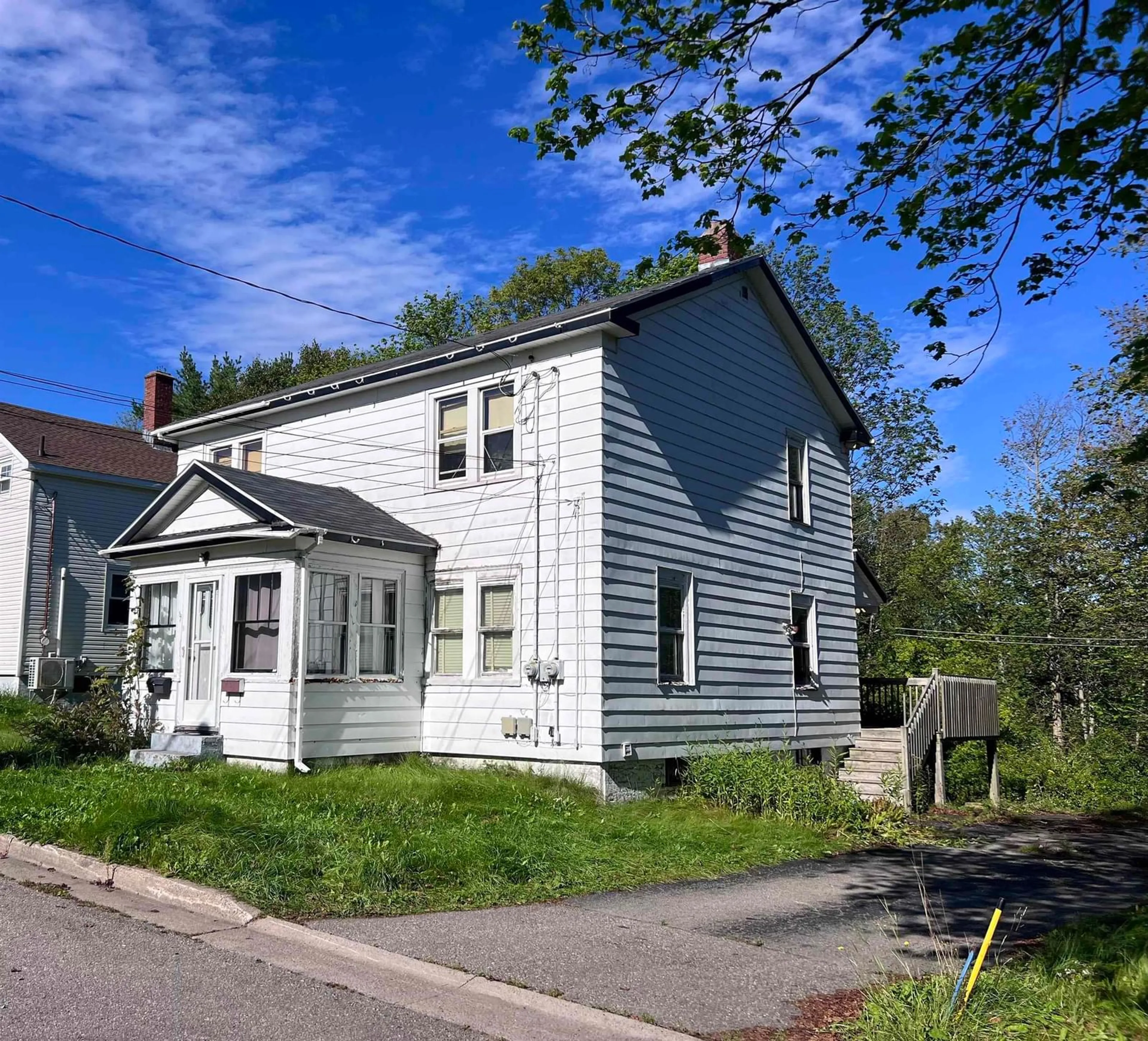 Home with vinyl exterior material, street for 61 Harrison Ave, Sydney Nova Scotia B1S 2Y3