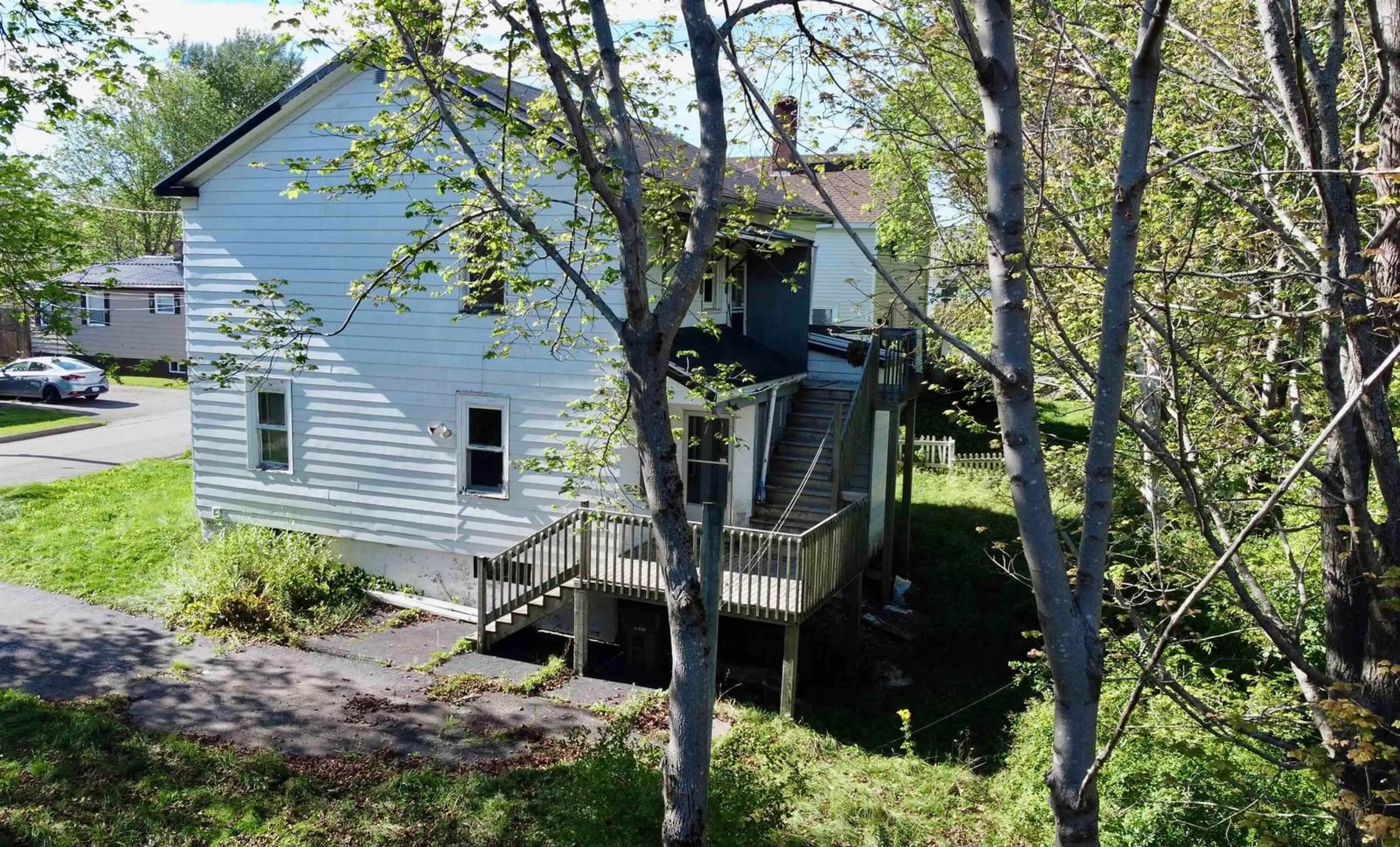 A pic from outside/outdoor area/front of a property/back of a property/a pic from drone, unknown for 61 Harrison Ave, Sydney Nova Scotia B1S 2Y3