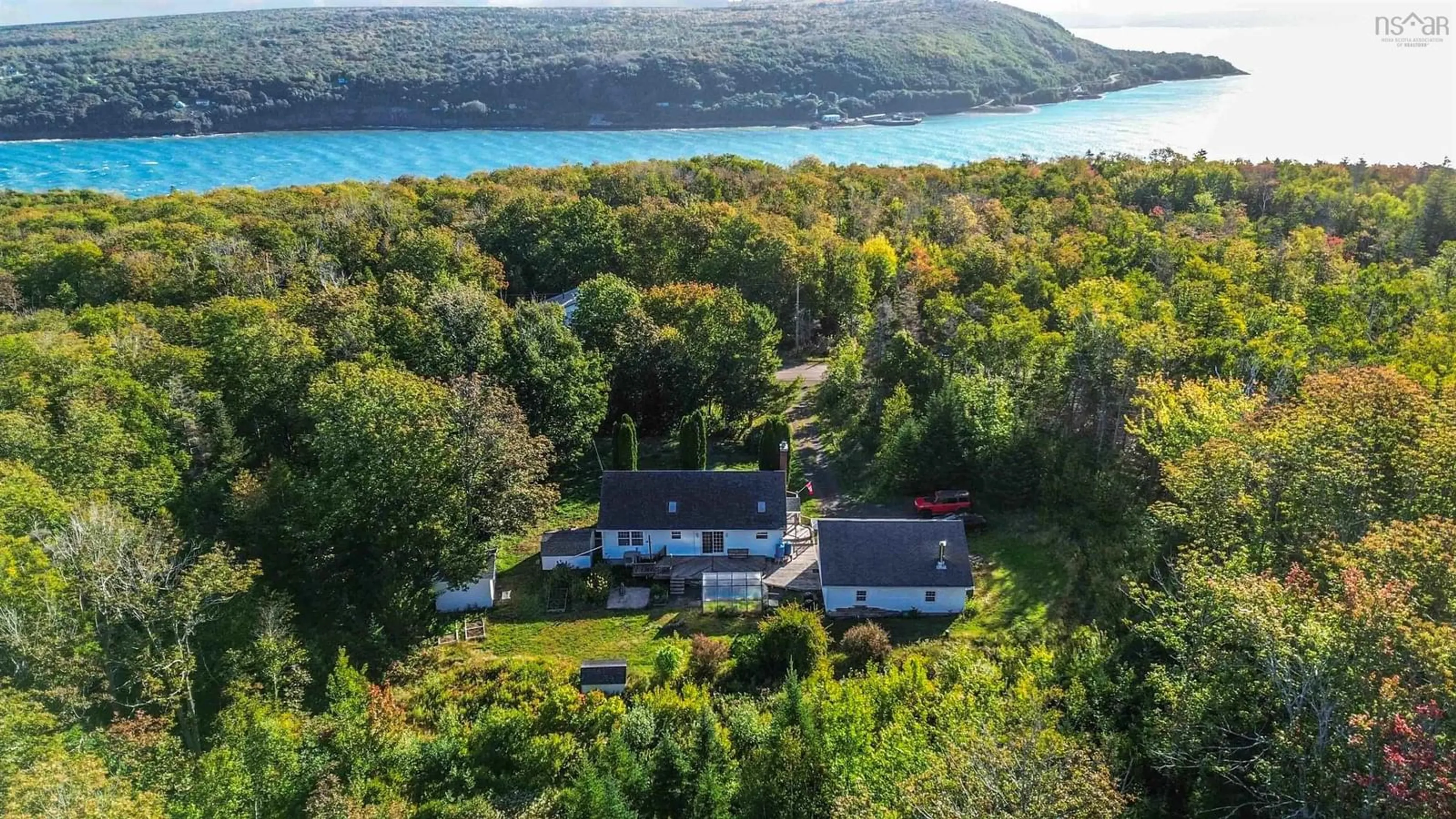 A pic from outside/outdoor area/front of a property/back of a property/a pic from drone, water/lake/river/ocean view for 989 Lighthouse Rd, Bay View Nova Scotia B0V 1A0