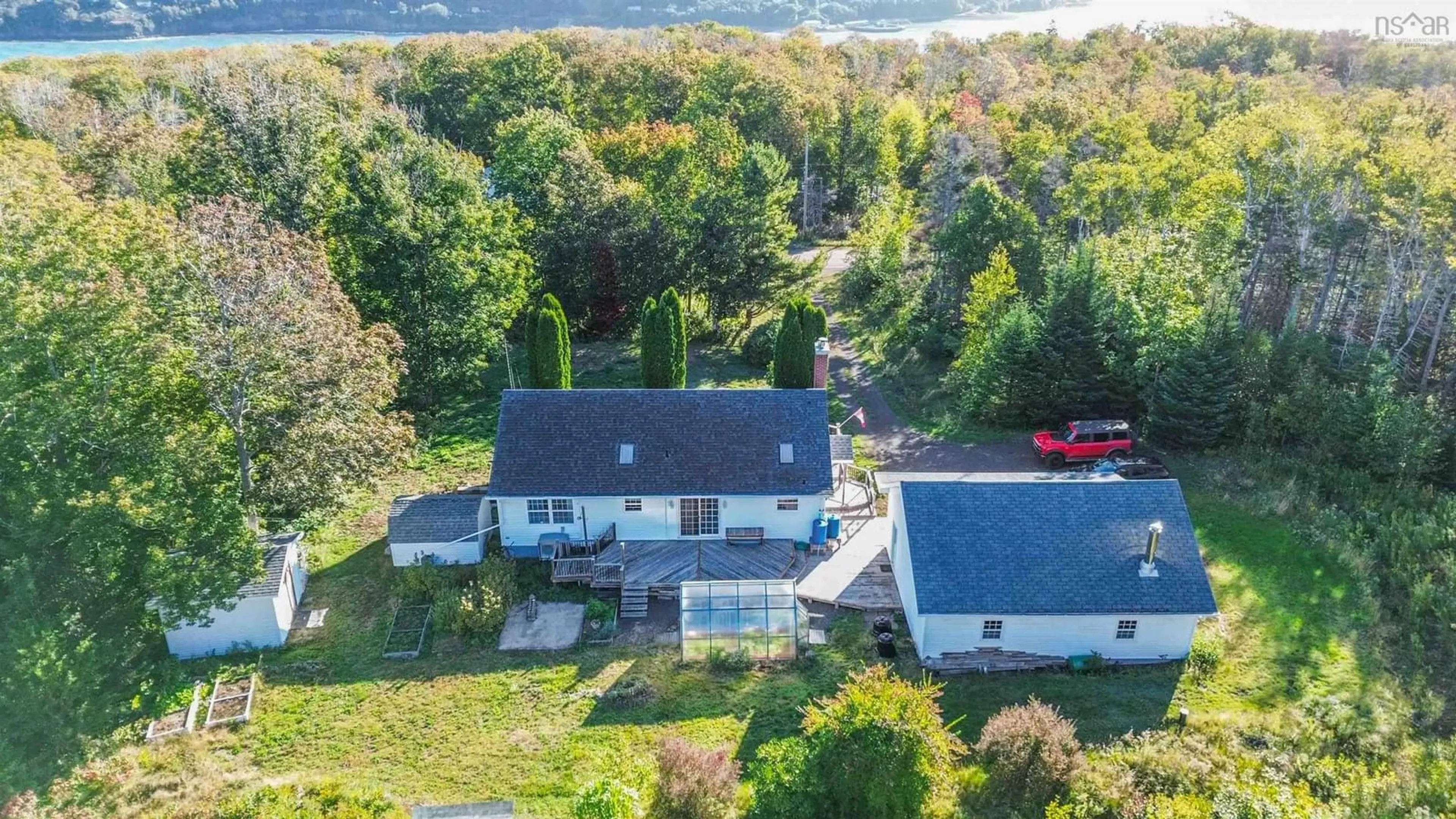 A pic from outside/outdoor area/front of a property/back of a property/a pic from drone, water/lake/river/ocean view for 989 Lighthouse Rd, Bay View Nova Scotia B0V 1A0