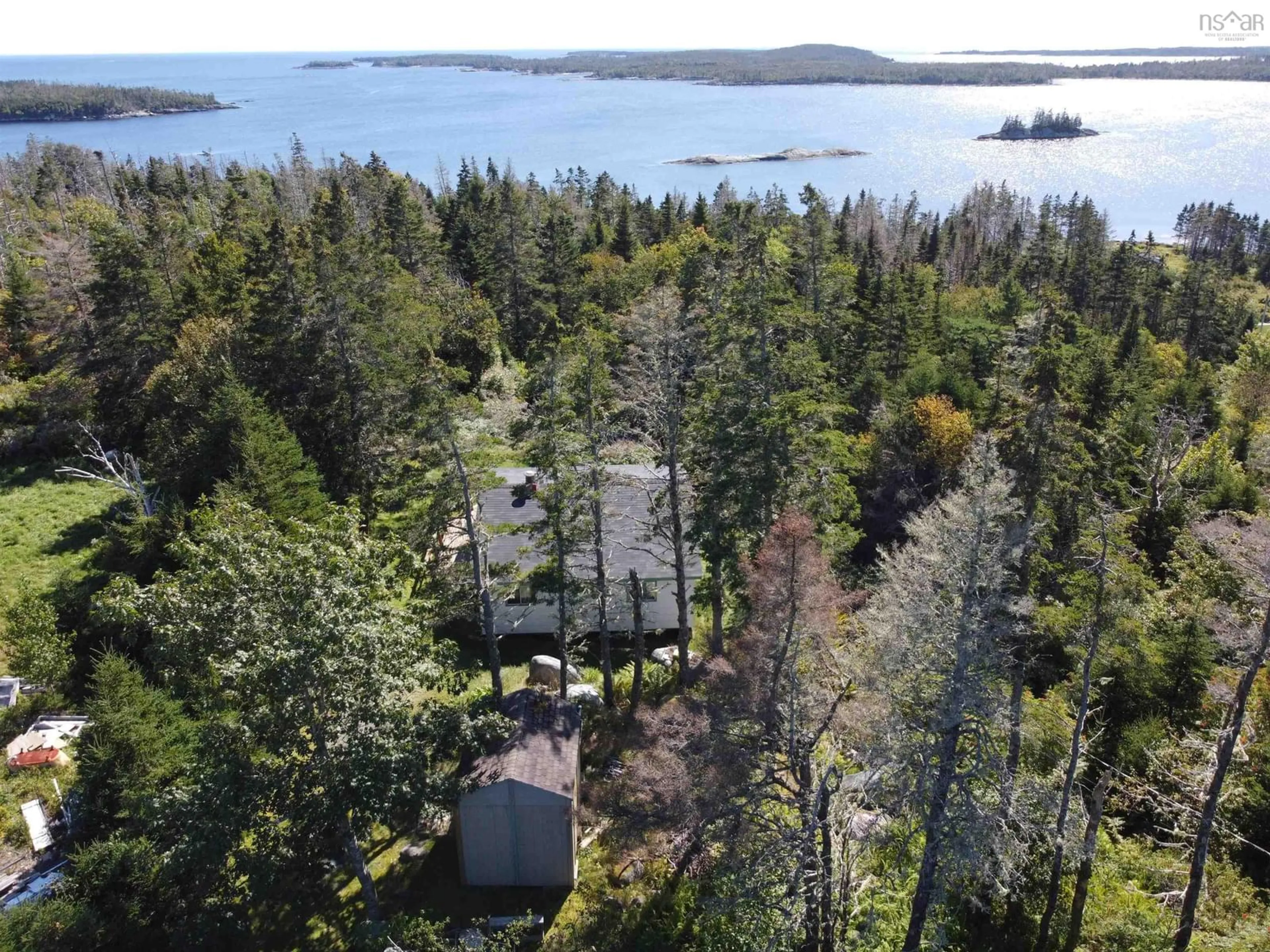 A pic from outside/outdoor area/front of a property/back of a property/a pic from drone, water/lake/river/ocean view for 18046 Highway 7, Popes Harbour Nova Scotia B0J 3H0