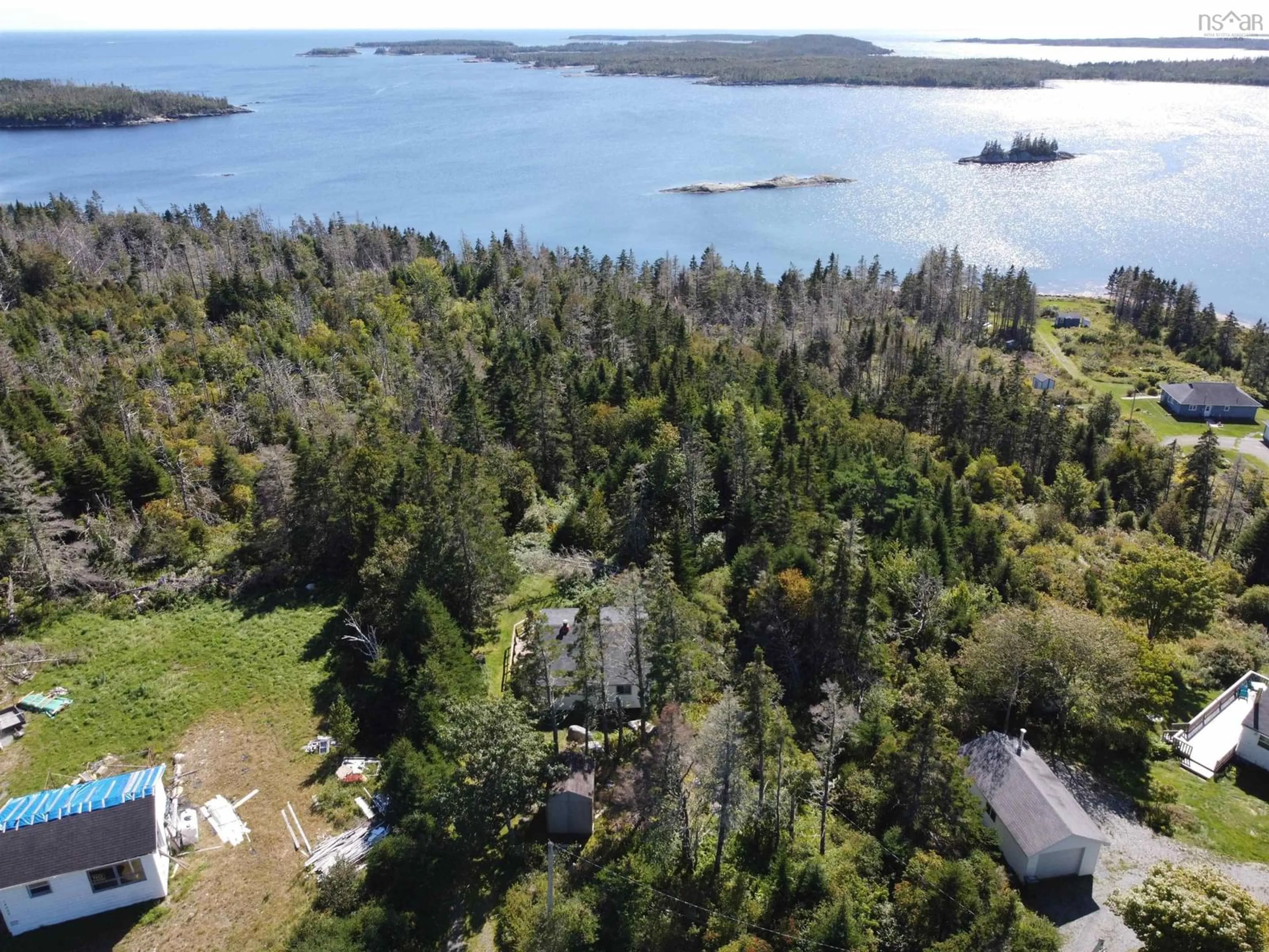 A pic from outside/outdoor area/front of a property/back of a property/a pic from drone, water/lake/river/ocean view for 18046 Highway 7, Popes Harbour Nova Scotia B0J 3H0