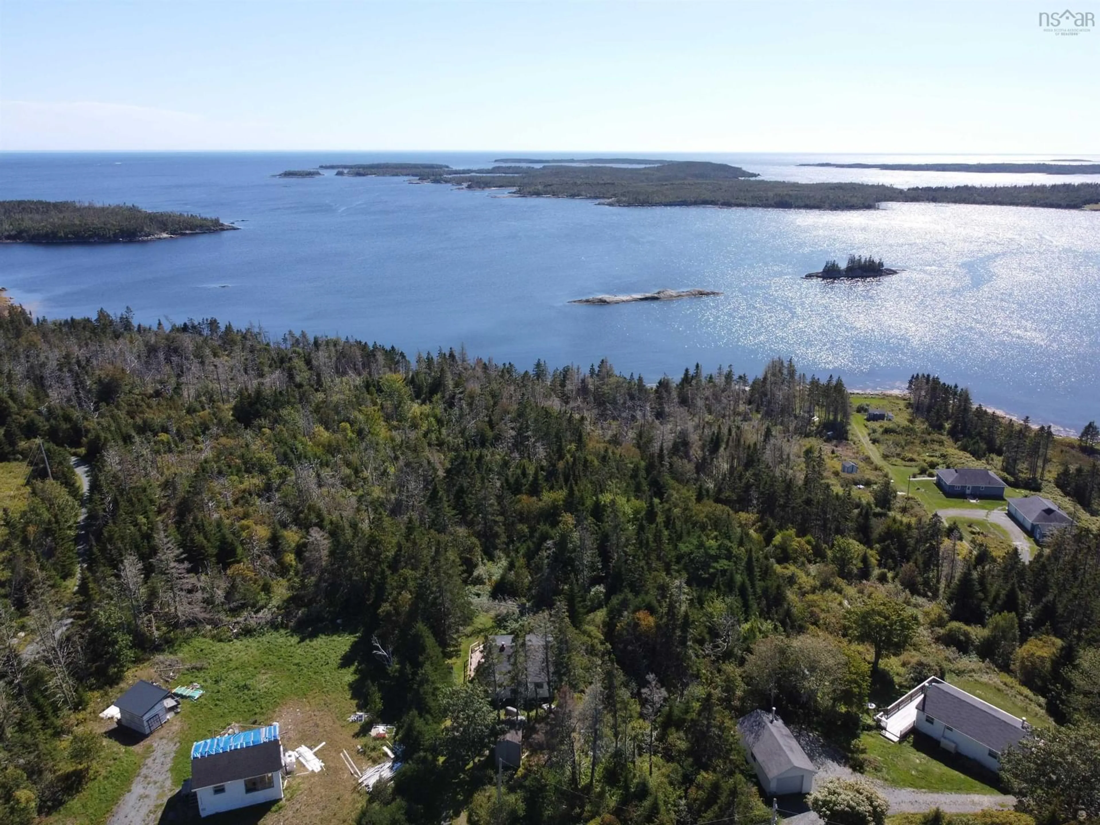 A pic from outside/outdoor area/front of a property/back of a property/a pic from drone, water/lake/river/ocean view for 18046 Highway 7, Popes Harbour Nova Scotia B0J 3H0