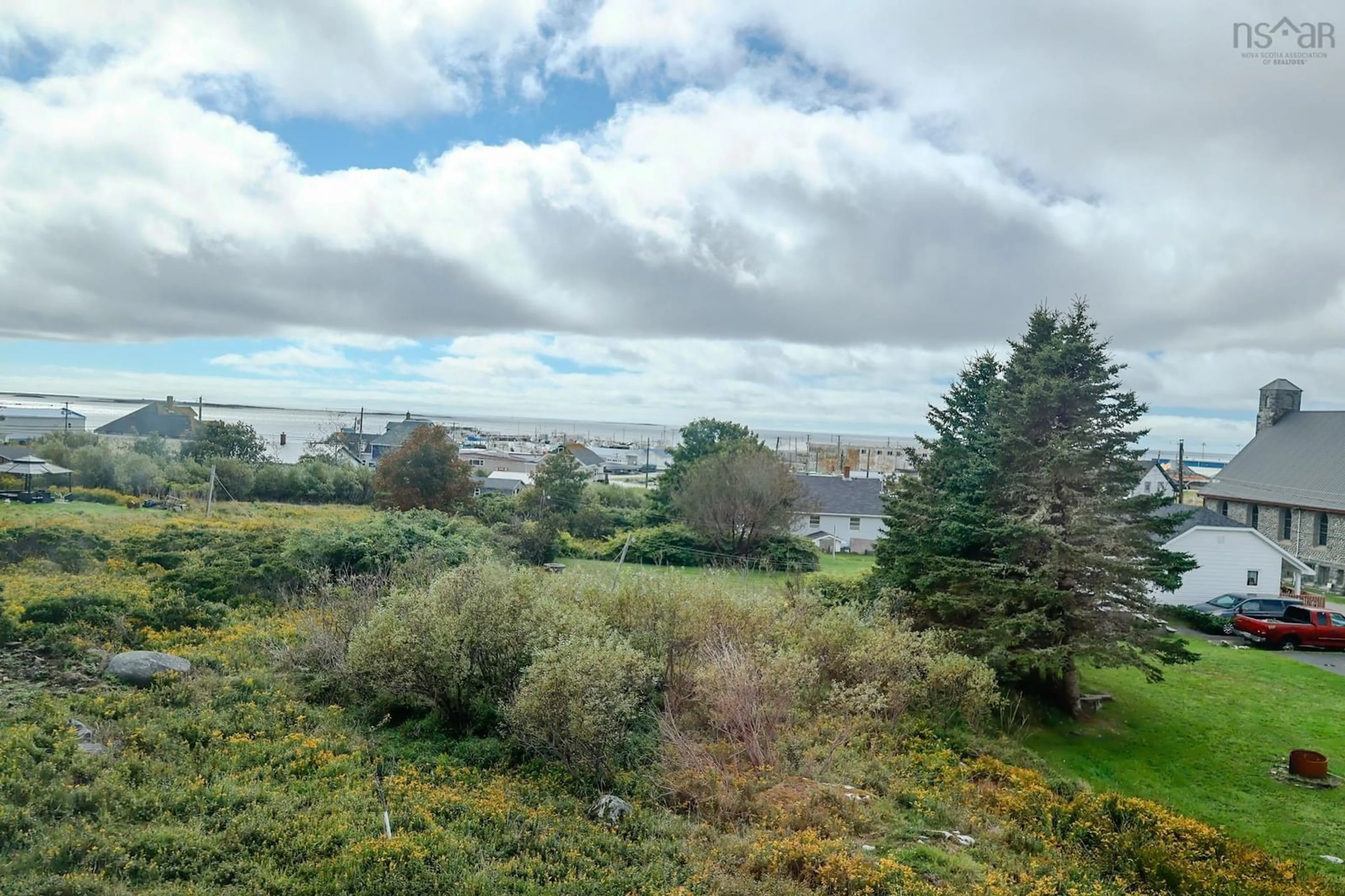 A pic from outside/outdoor area/front of a property/back of a property/a pic from drone, water/lake/river/ocean view for 32 Church Rd, Clark's Harbour Nova Scotia B0W 1P0