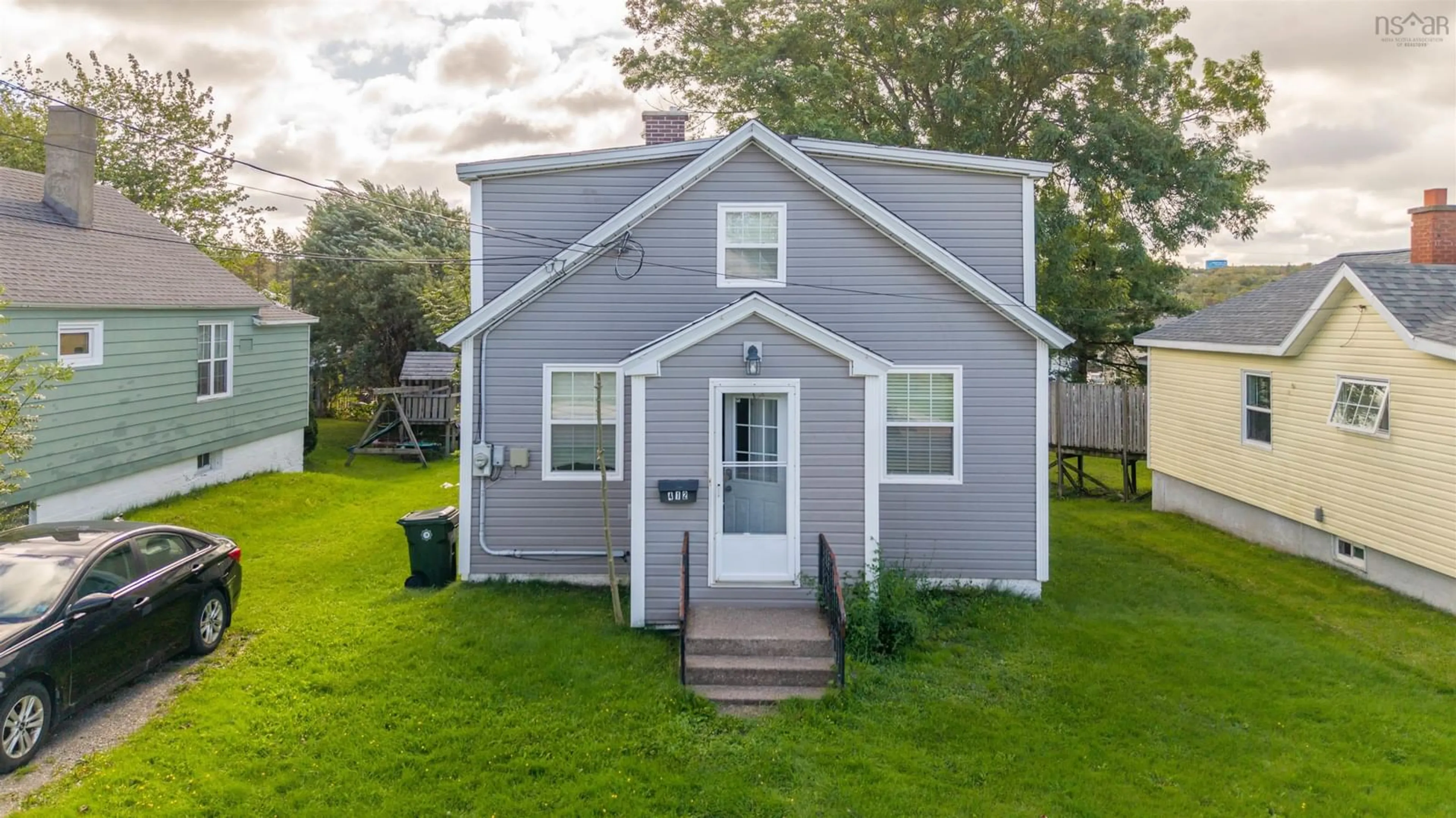 Home with vinyl exterior material, street for 412 Atlantic St, Sydney Nova Scotia B1P 3R8