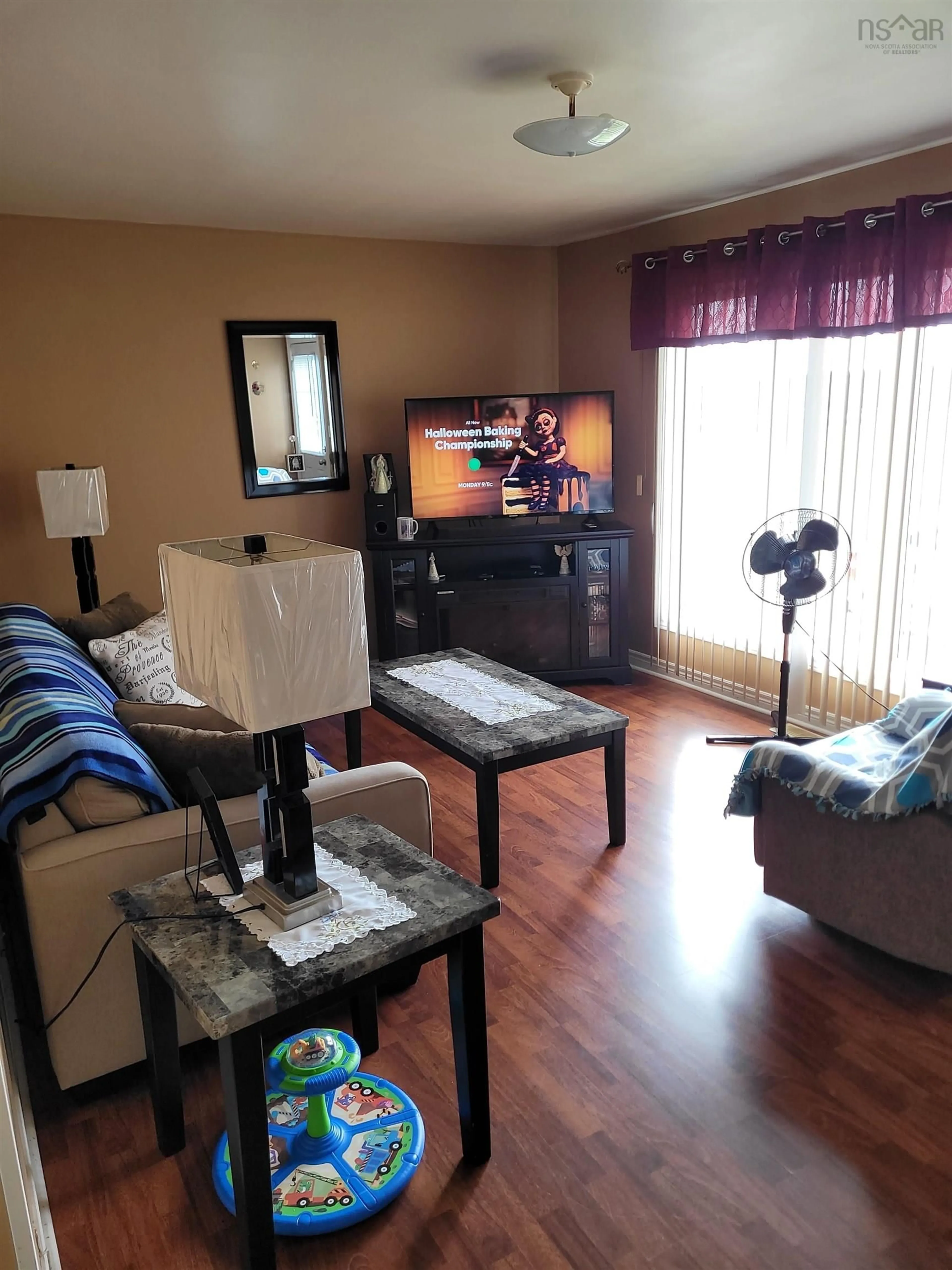 Living room with furniture, wood/laminate floor for 23 Warren St, Glace Bay Nova Scotia B1A 1E1