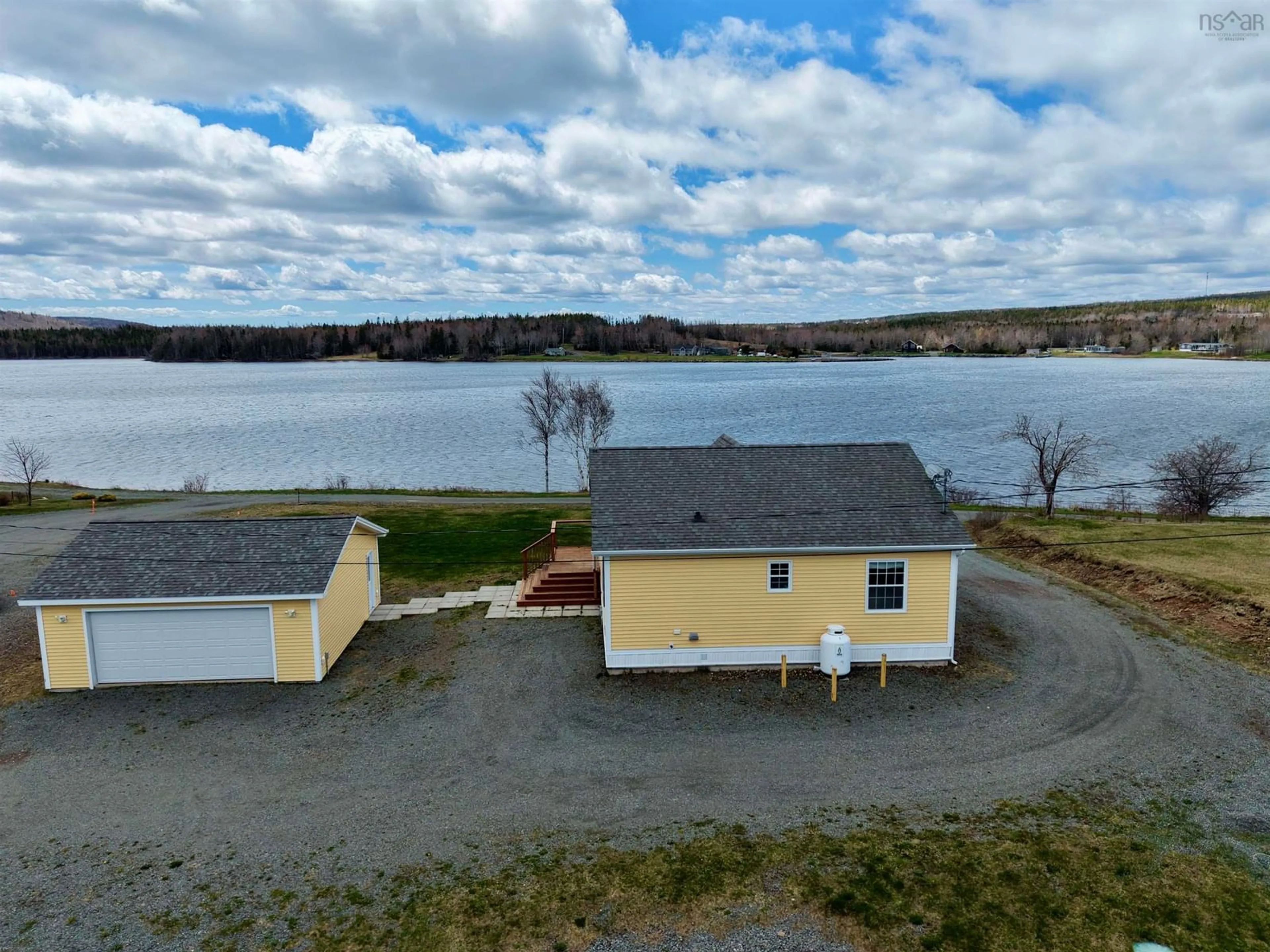 A pic from outside/outdoor area/front of a property/back of a property/a pic from drone, water/lake/river/ocean view for 153 Burkes Rd., French Cove Nova Scotia B0E 3B0