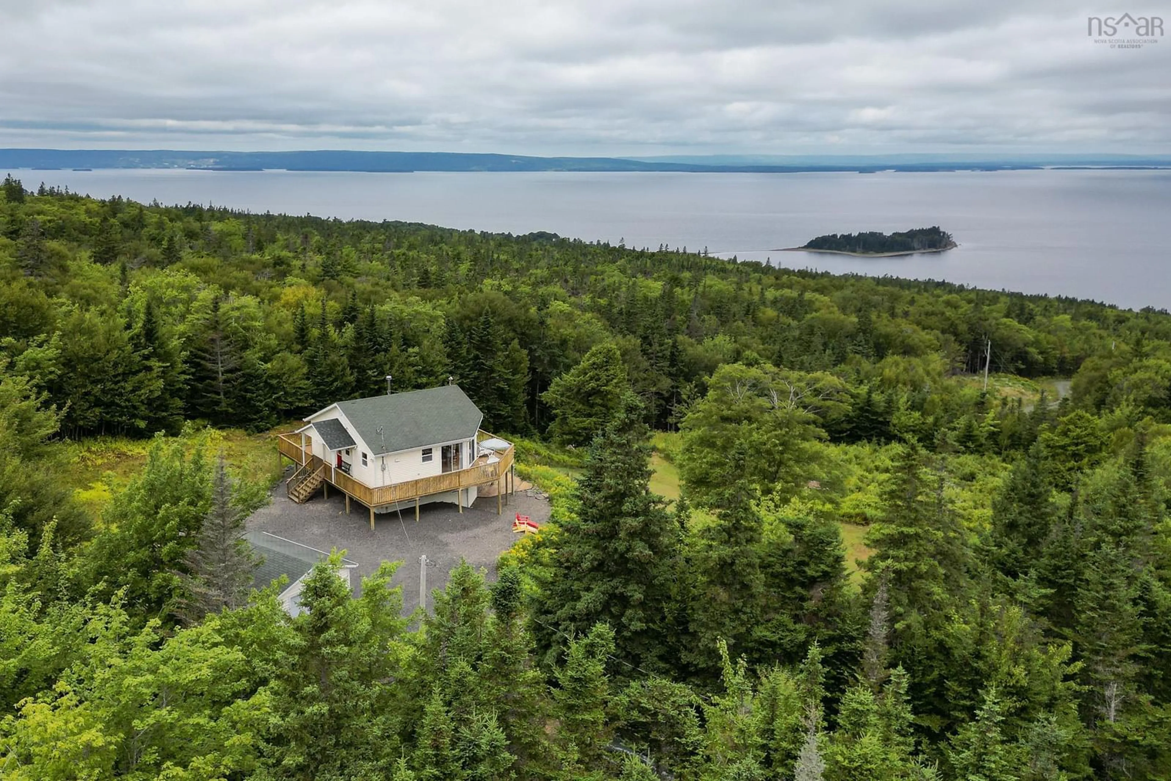 A pic from outside/outdoor area/front of a property/back of a property/a pic from drone, water/lake/river/ocean view for 74 6101 Rd (Leo’s Lane), Roberta Nova Scotia B0E 2K0