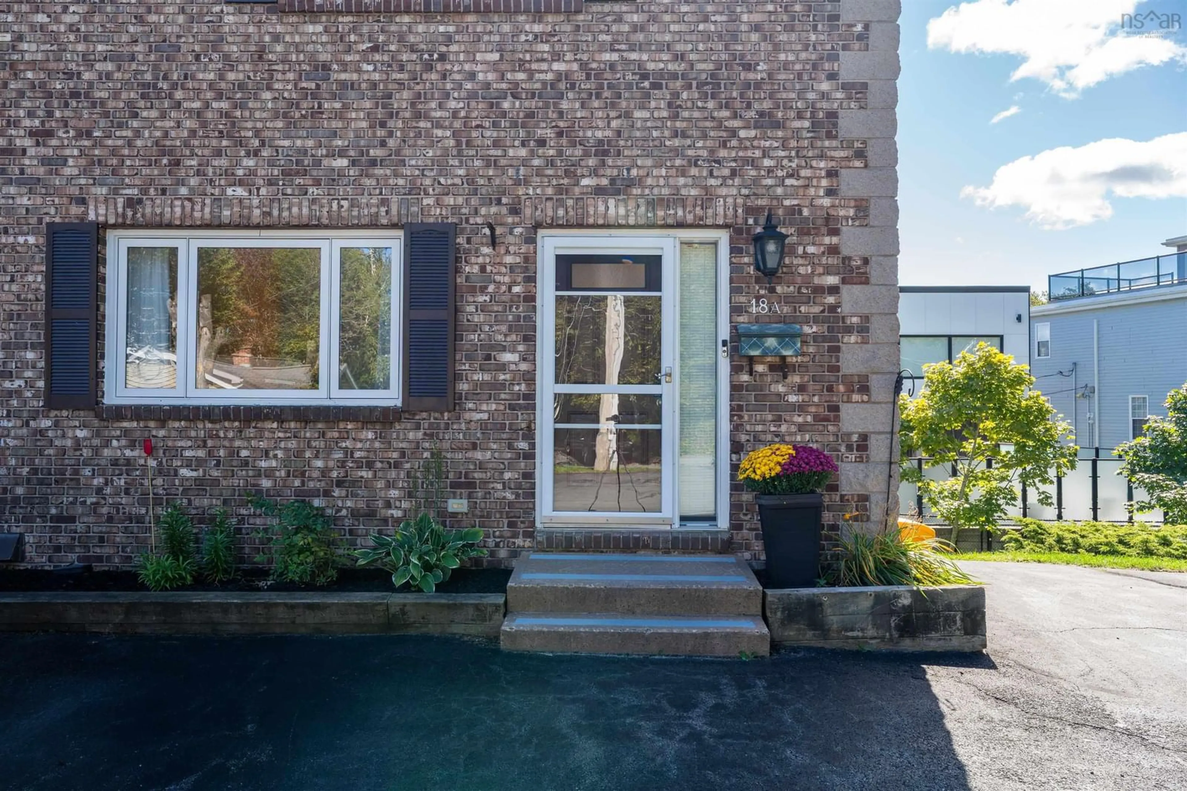Home with brick exterior material, street for 18 A Pioneer Ave #1, Halifax Nova Scotia B3M 1W8