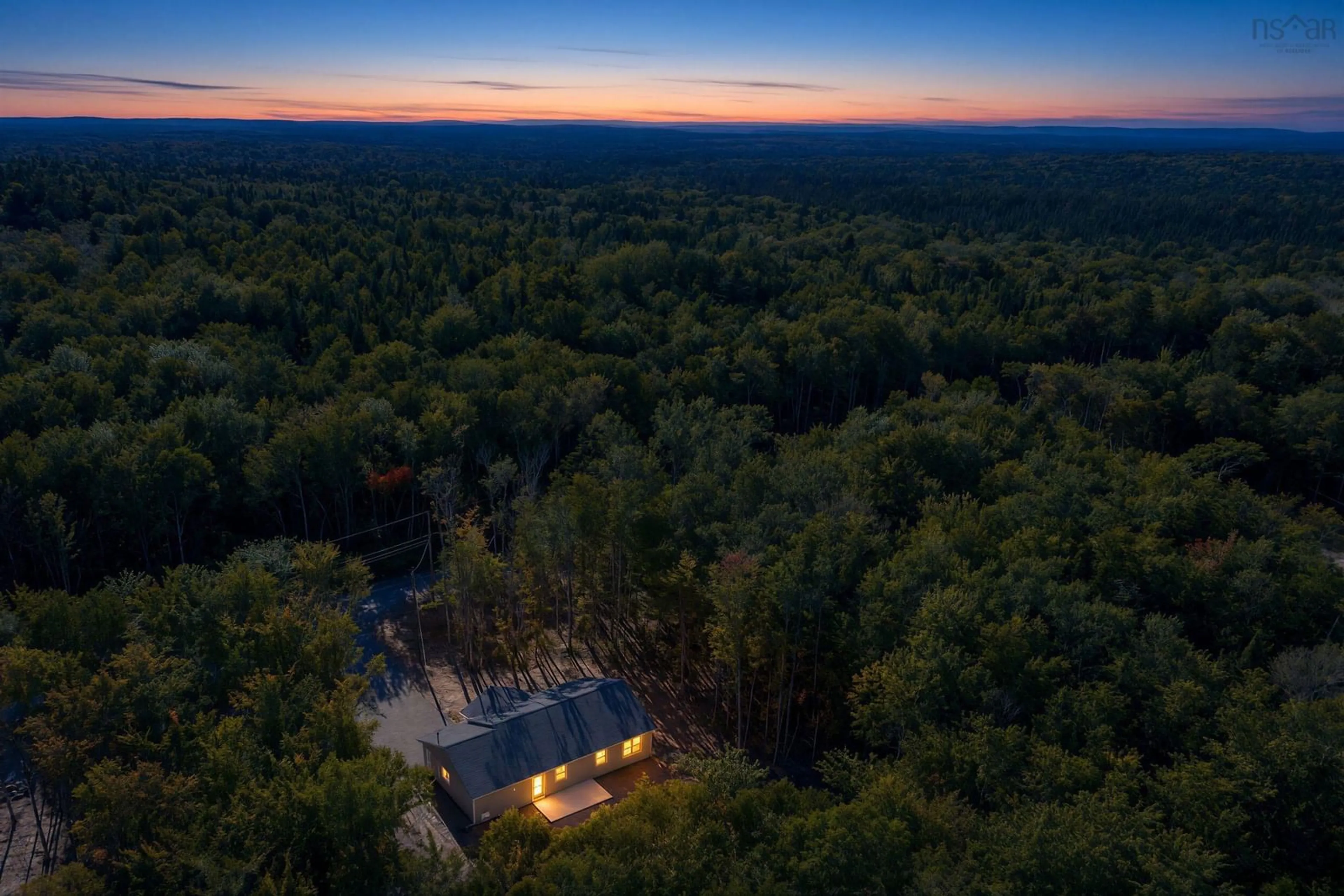 A pic from outside/outdoor area/front of a property/back of a property/a pic from drone, forest/trees view for 62 Ronald Lane, East Uniacke Nova Scotia B0N 1Z0