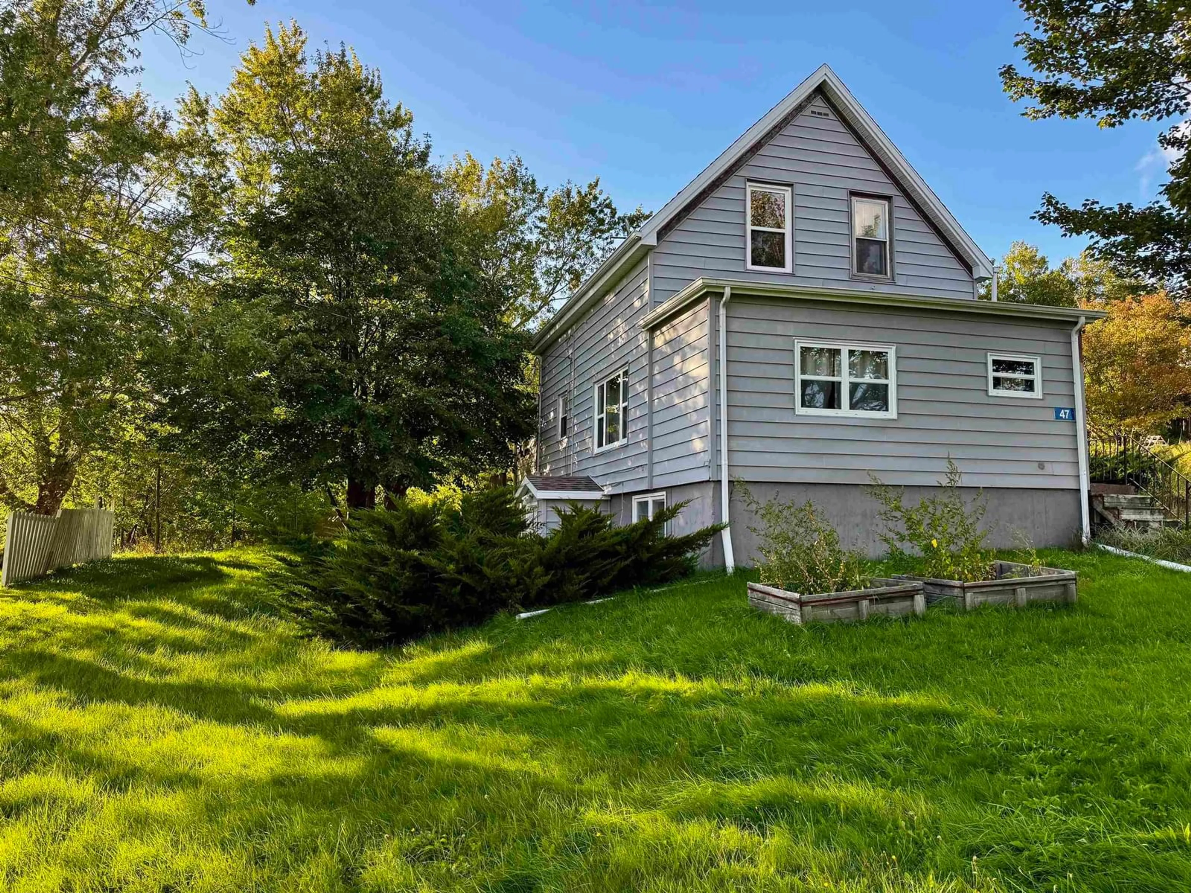 Home with vinyl exterior material, street for 47 Old Victoria Road, Port Hastings Nova Scotia B9A 1L2