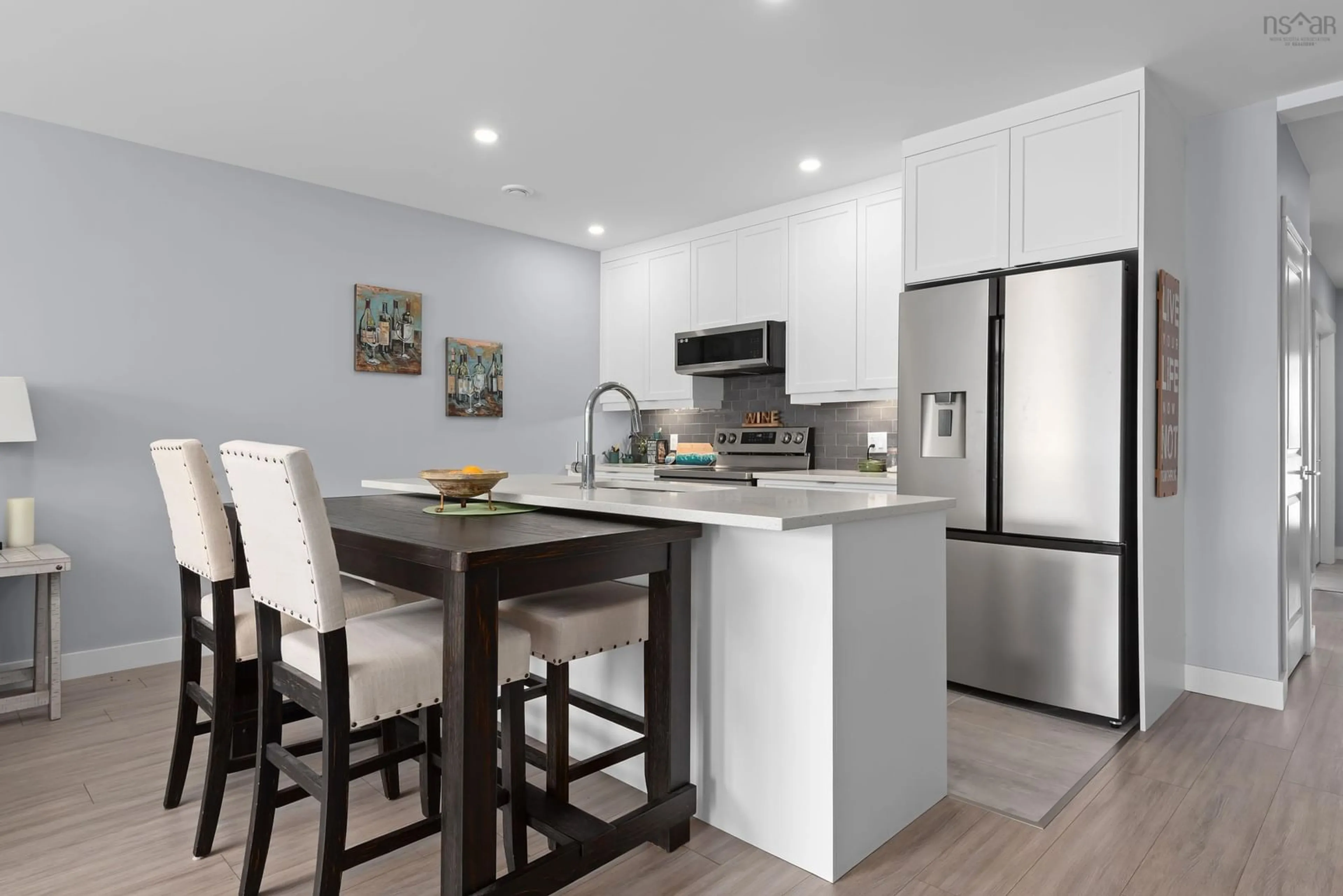Open concept kitchen, wood/laminate floor for 17 Moonlit Ridge, Eastern Passage Nova Scotia B3G 0H5