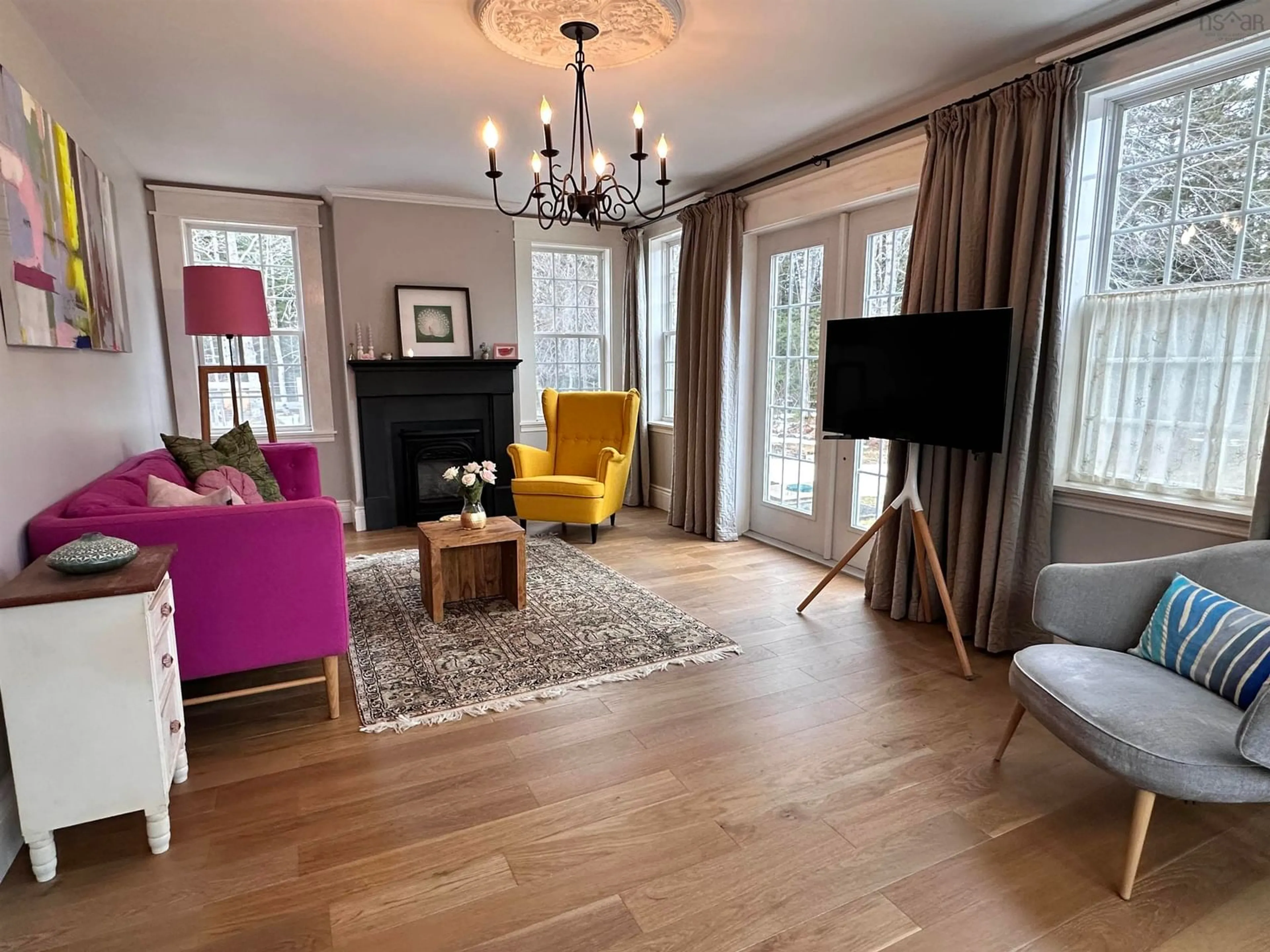 Living room with furniture, wood/laminate floor for 151 Medway River Rd, Mill Village Nova Scotia B0J 2H0