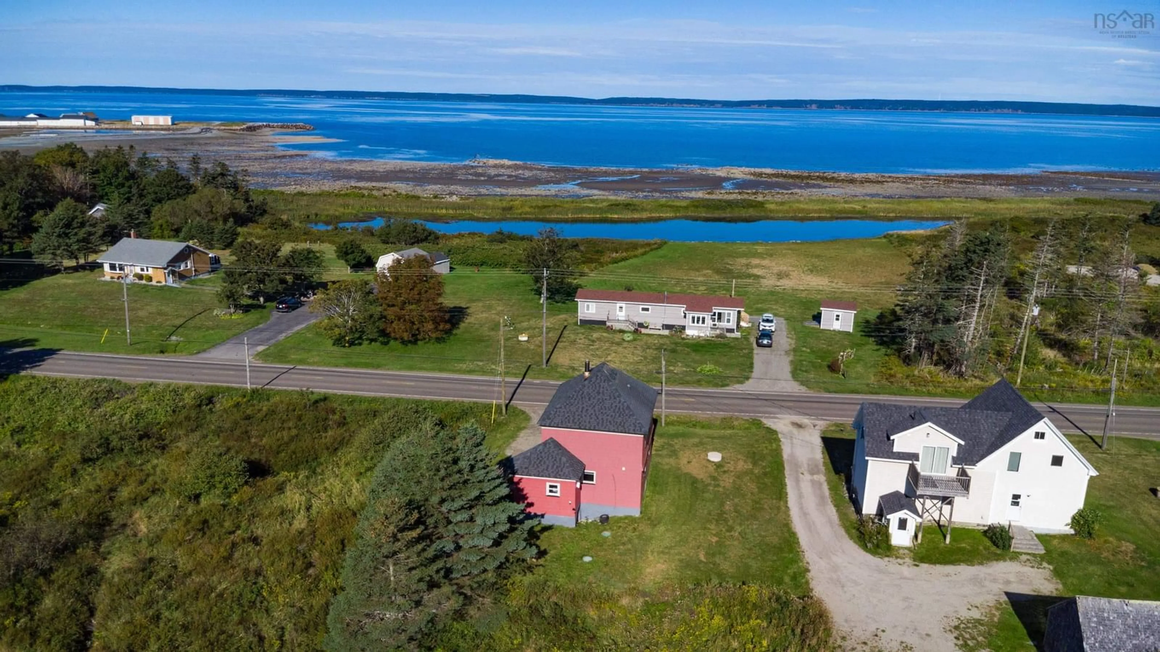 A pic from outside/outdoor area/front of a property/back of a property/a pic from drone, water/lake/river/ocean view for 2008 Highway 1, Church Point Nova Scotia B0W 1M0