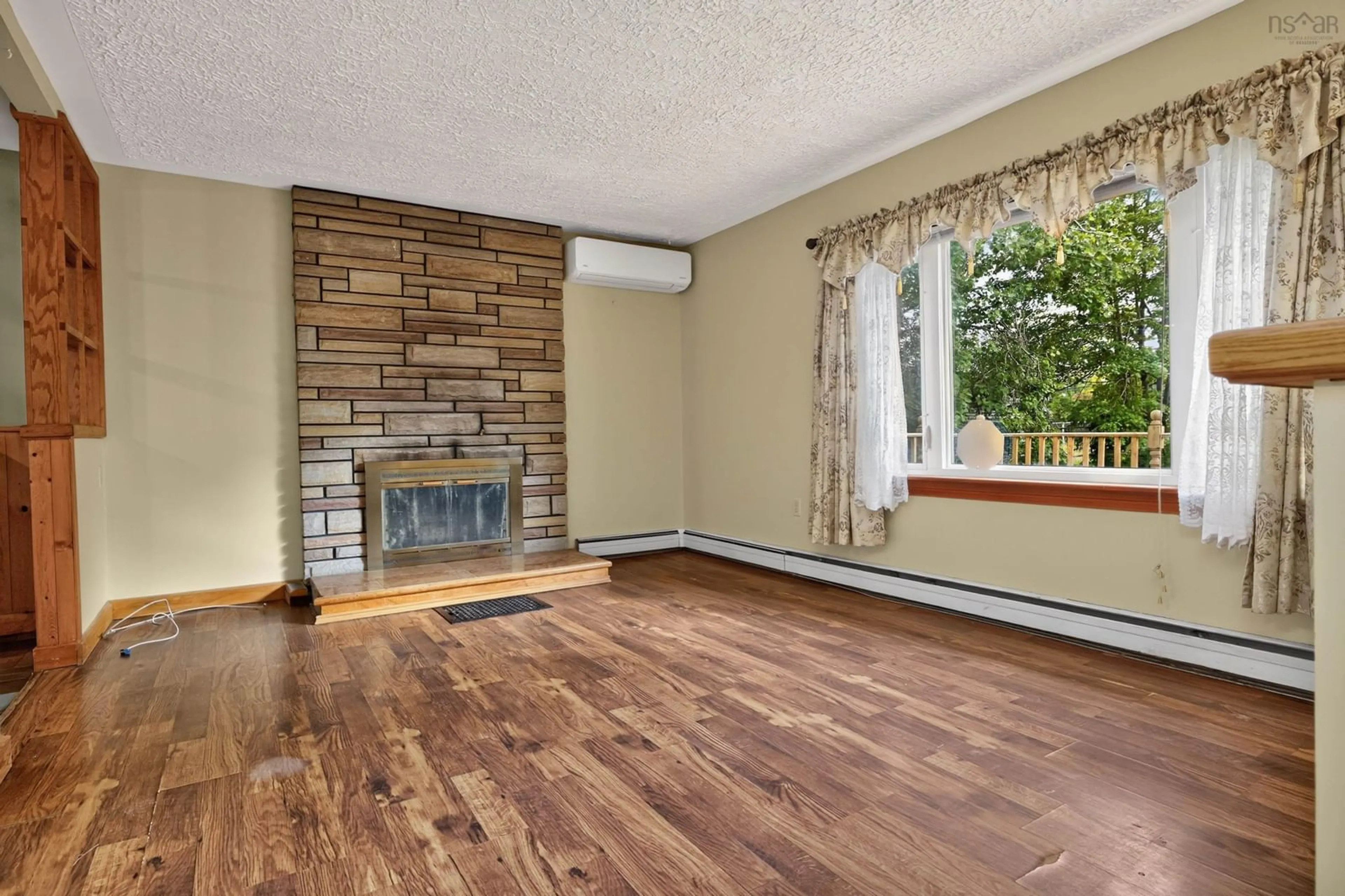 Living room with furniture, wood/laminate floor for 2587 Sackville Dr, Upper Sackville Nova Scotia B4E 3C3