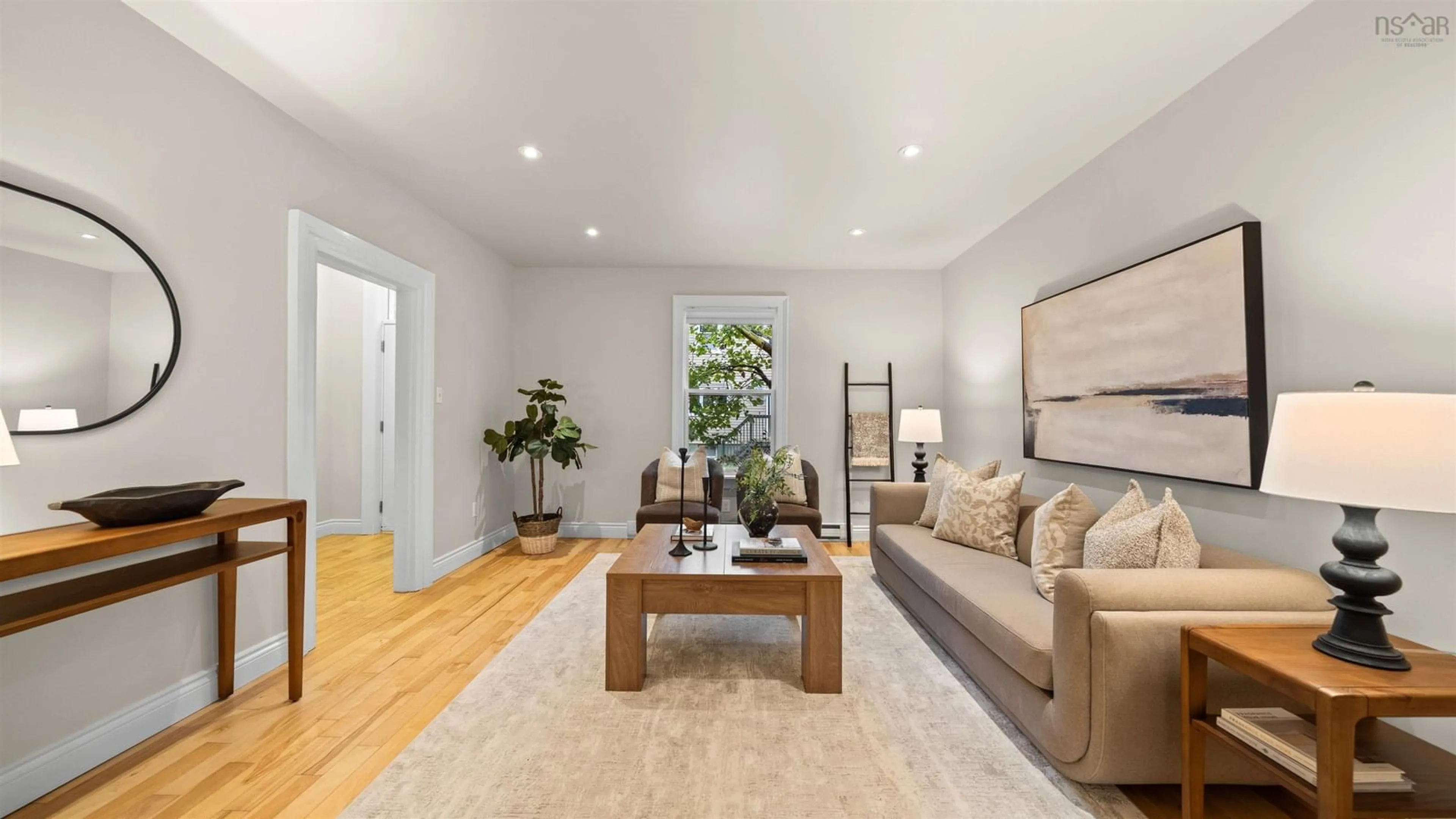 Living room with furniture, wood/laminate floor for 2355 Maynard St, Halifax Peninsula Nova Scotia B3K 3T9