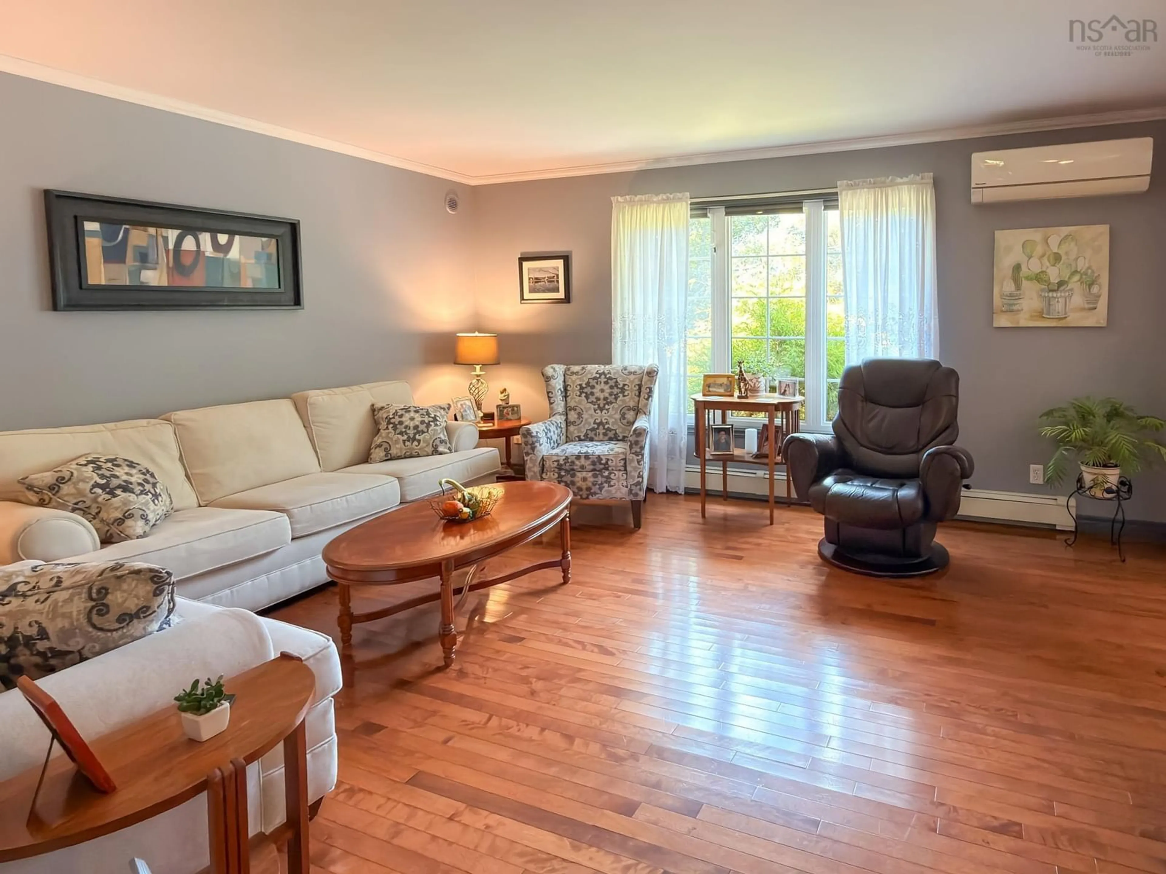 Living room with furniture, wood/laminate floor for 120 Dawson Hts, Pine Grove Nova Scotia B0J 1E0