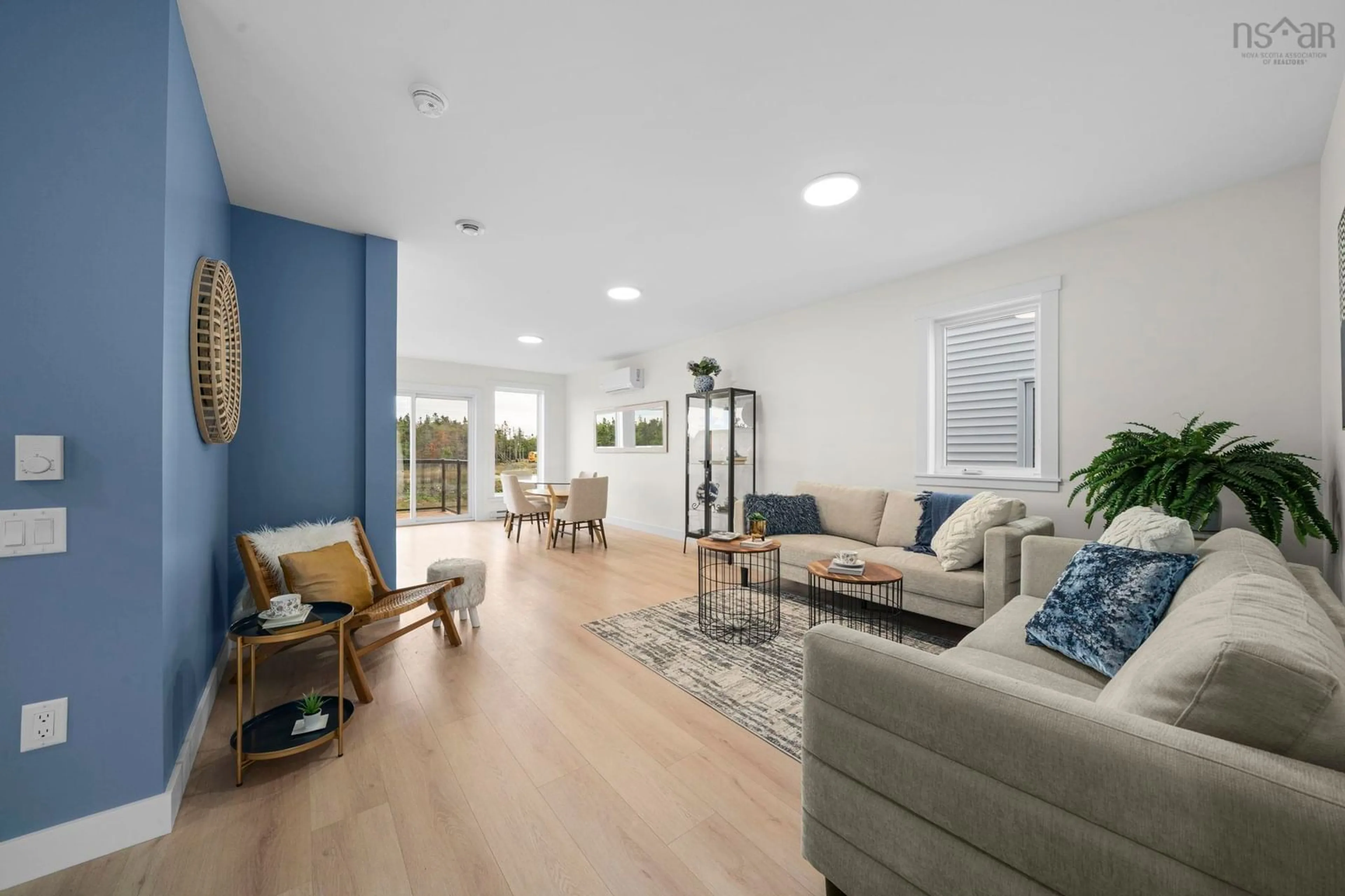 Living room with furniture, wood/laminate floor for 32 Berm St, Spryfield Nova Scotia B3R 0H2
