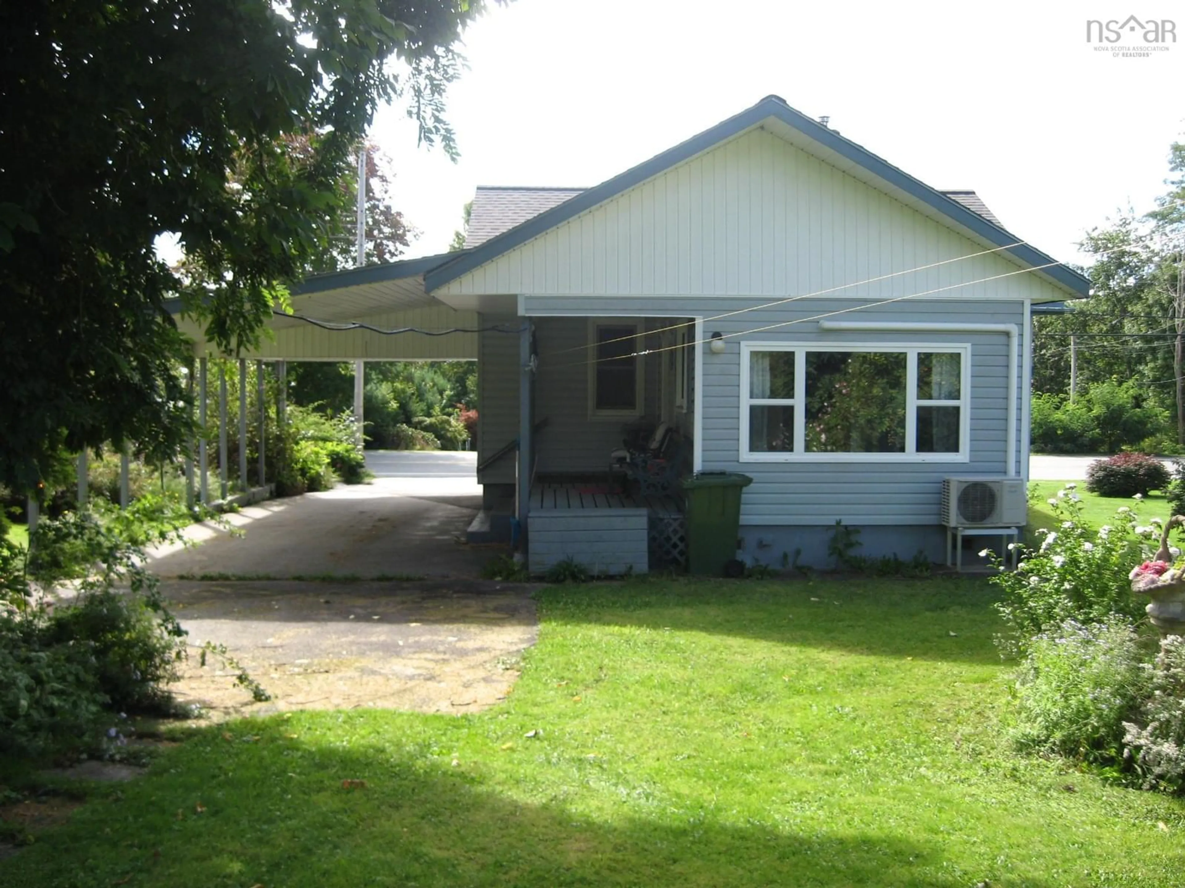 Home with vinyl exterior material, street for 103 Highway 8, Milton Nova Scotia B0T 1P0