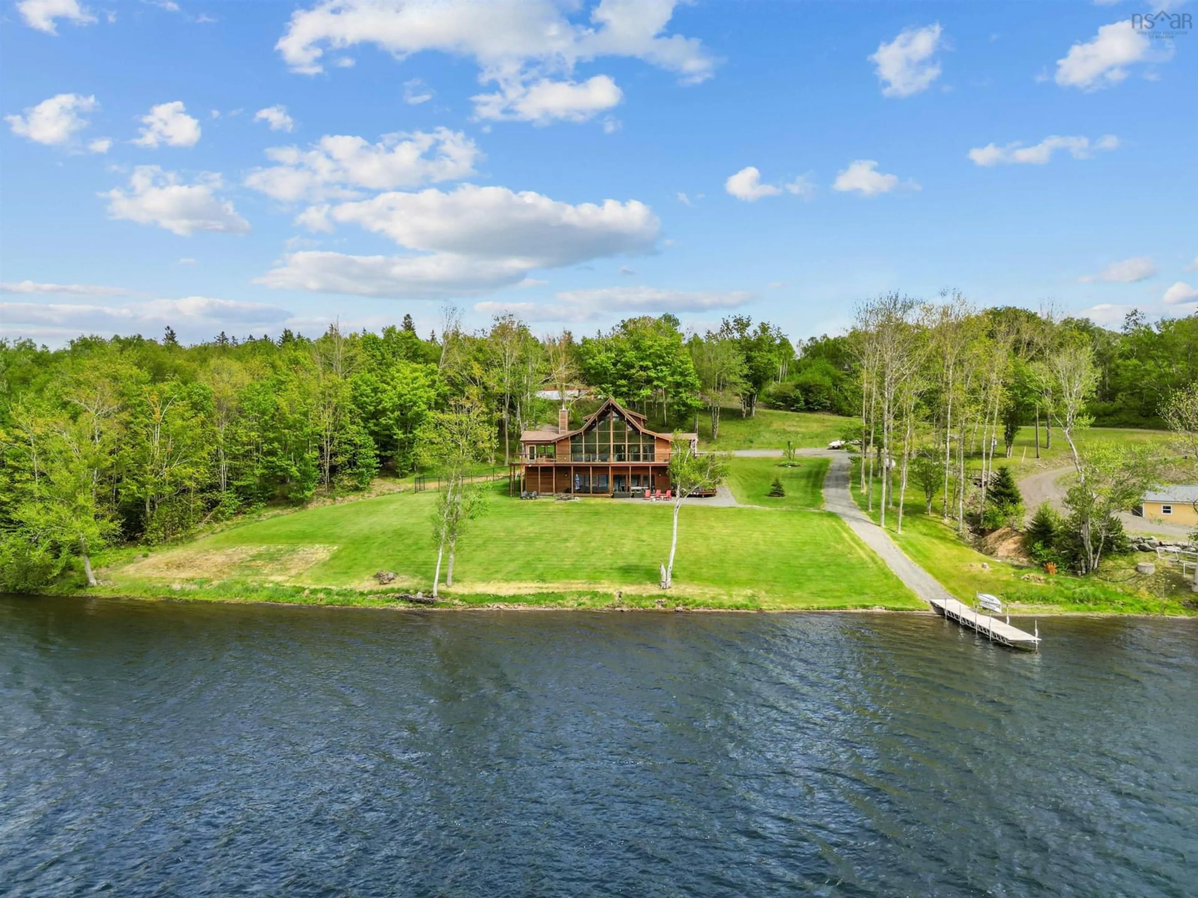 A pic from outside/outdoor area/front of a property/back of a property/a pic from drone, water/lake/river/ocean view for 16 Sunset Lane, Goshen Nova Scotia B0H 1E0