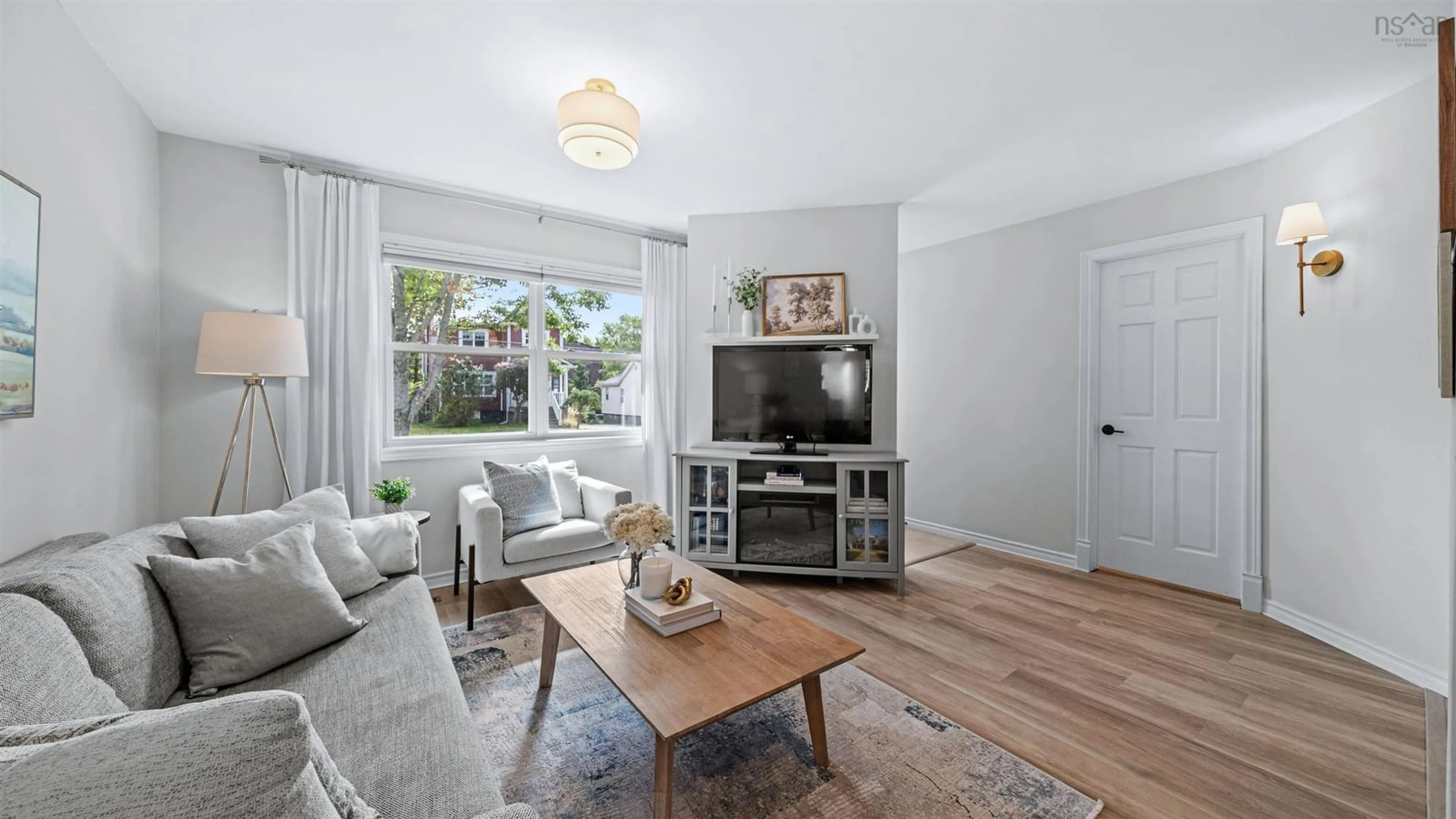 Living room with furniture, wood/laminate floor for 6467 Almon St, Halifax Nova Scotia B3L 1V6