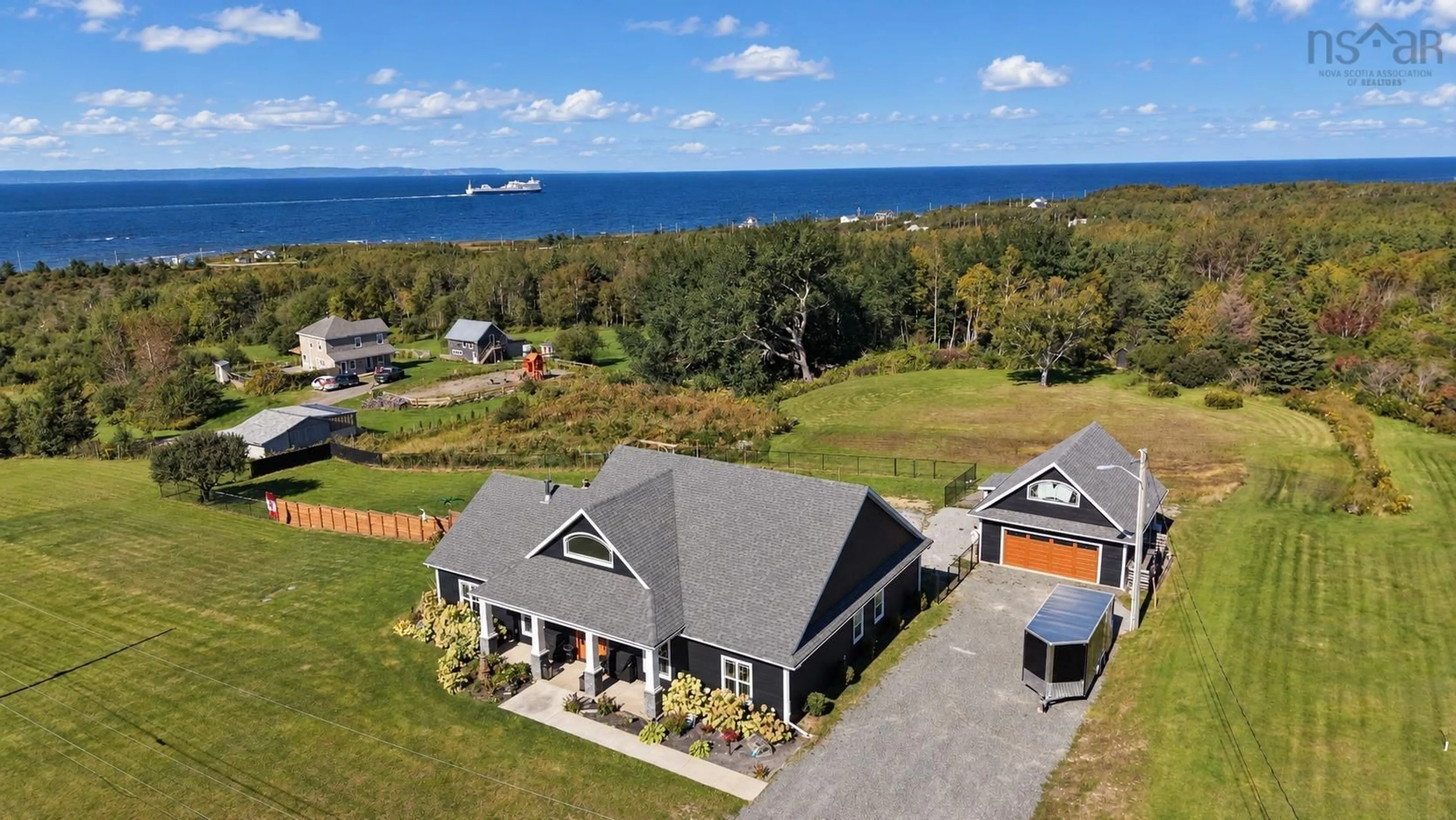 A pic from outside/outdoor area/front of a property/back of a property/a pic from drone, water/lake/river/ocean view for 127 Lake Rd, Victoria Mines Nova Scotia B1N 3J7