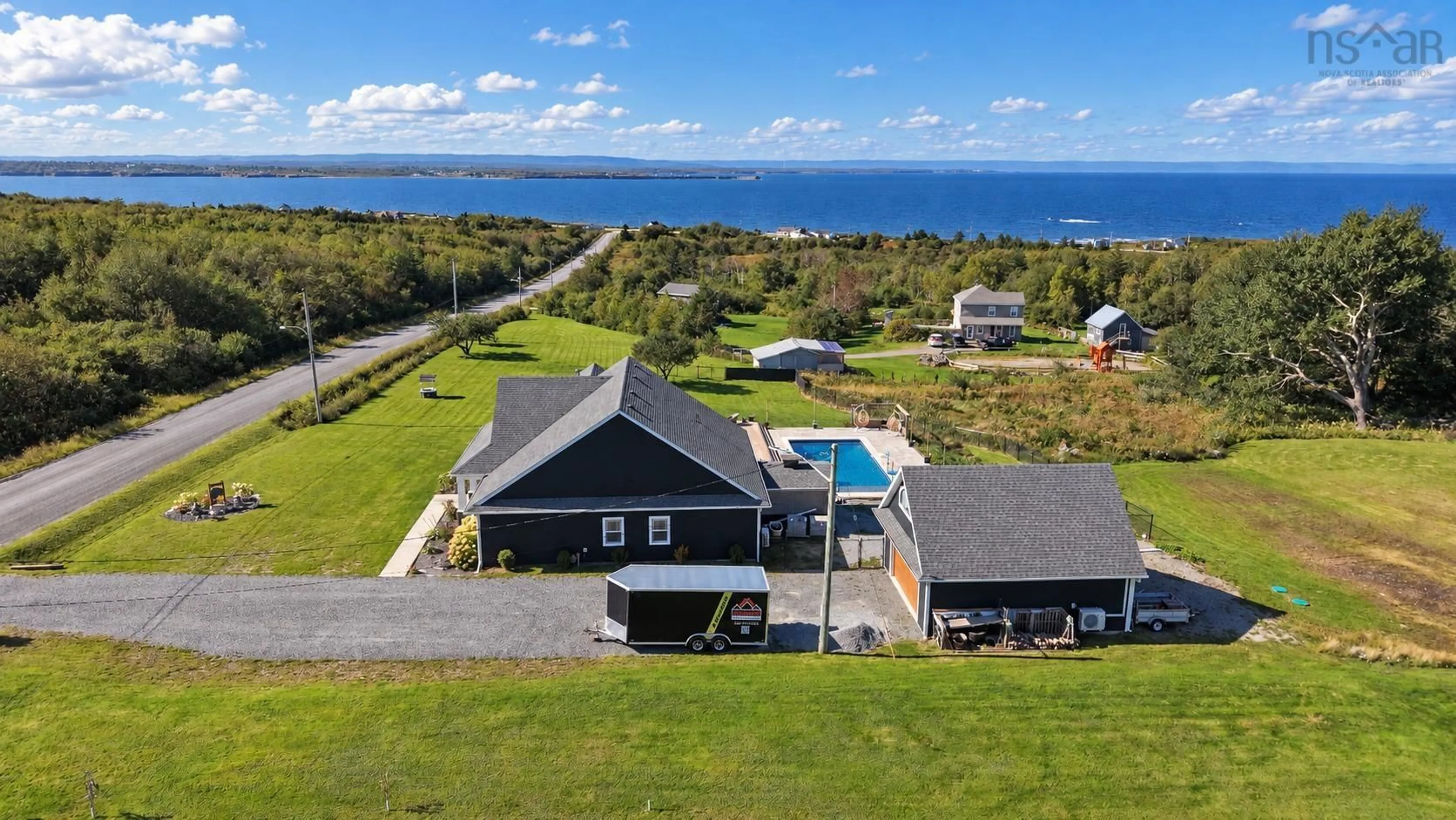 A pic from outside/outdoor area/front of a property/back of a property/a pic from drone, water/lake/river/ocean view for 127 Lake Rd, Victoria Mines Nova Scotia B1N 3J7