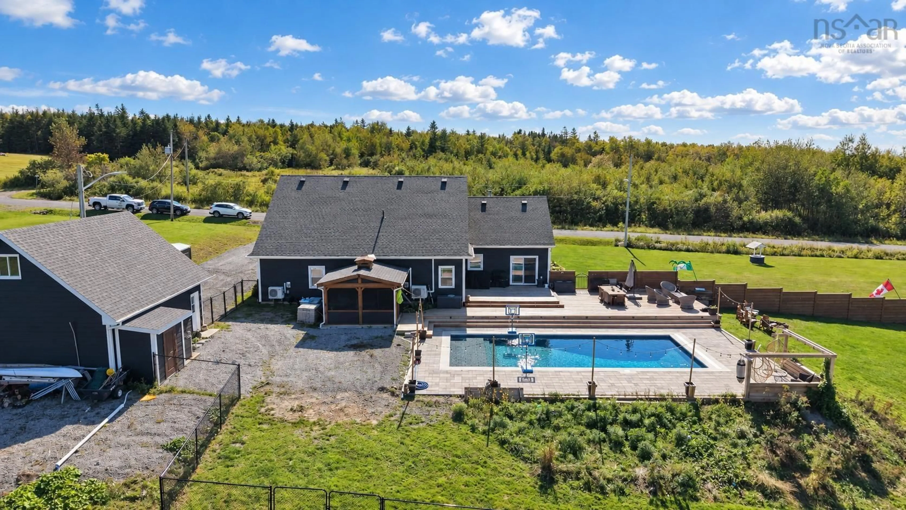 A pic from outside/outdoor area/front of a property/back of a property/a pic from drone, water/lake/river/ocean view for 127 Lake Rd, Victoria Mines Nova Scotia B1N 3J7