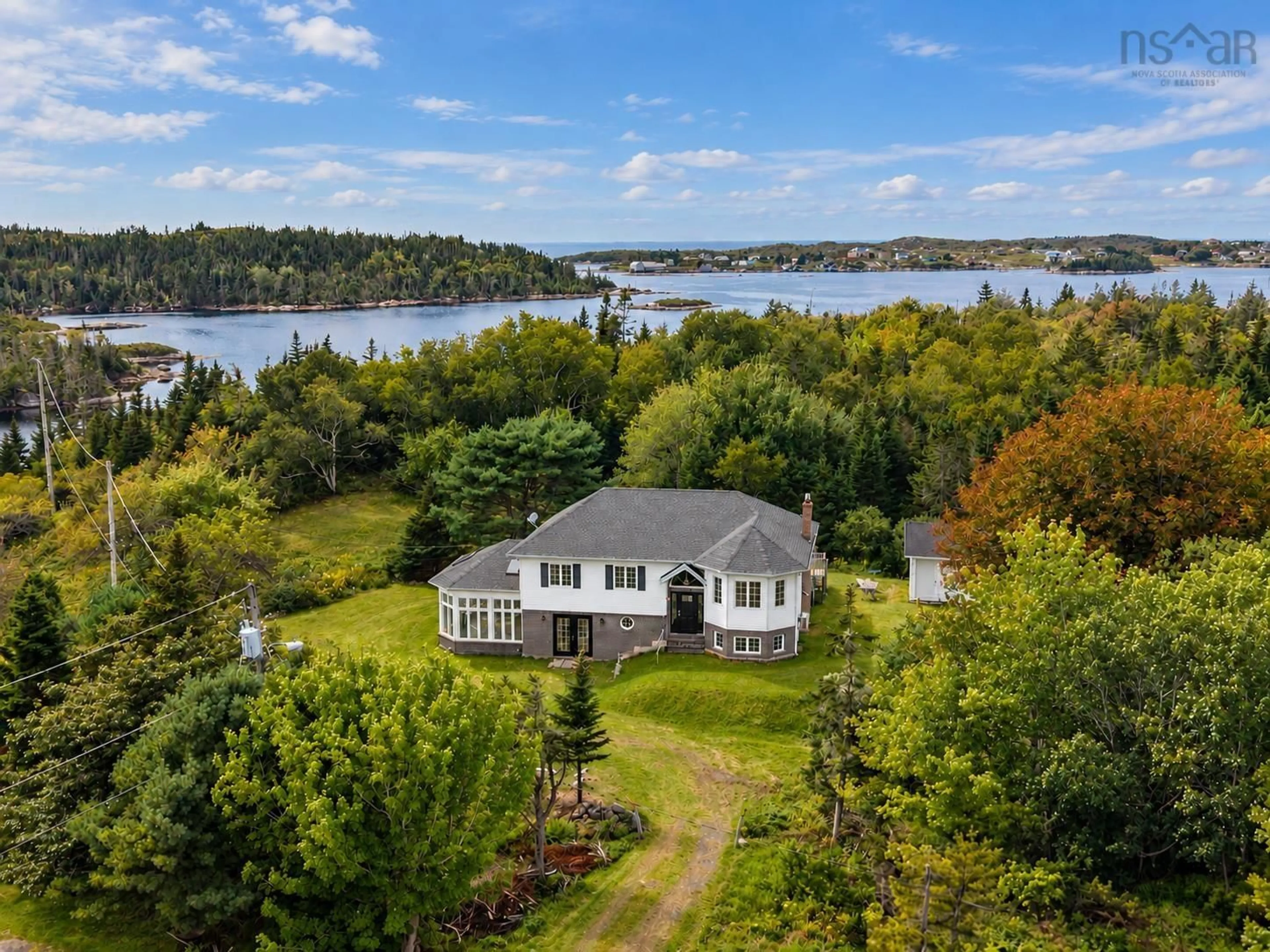 A pic from outside/outdoor area/front of a property/back of a property/a pic from drone, water/lake/river/ocean view for 257 East Dover Rd, East Dover Nova Scotia B3Z 3W4