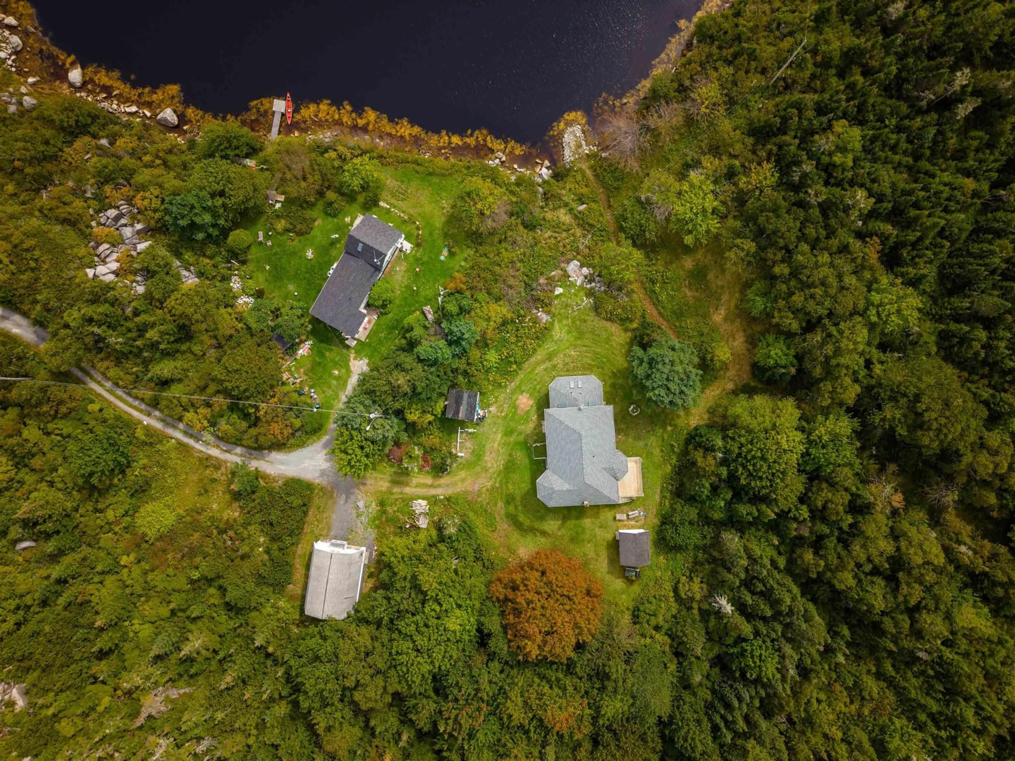 A pic from outside/outdoor area/front of a property/back of a property/a pic from drone, water/lake/river/ocean view for 257 East Dover Rd, East Dover Nova Scotia B3Z 3W4
