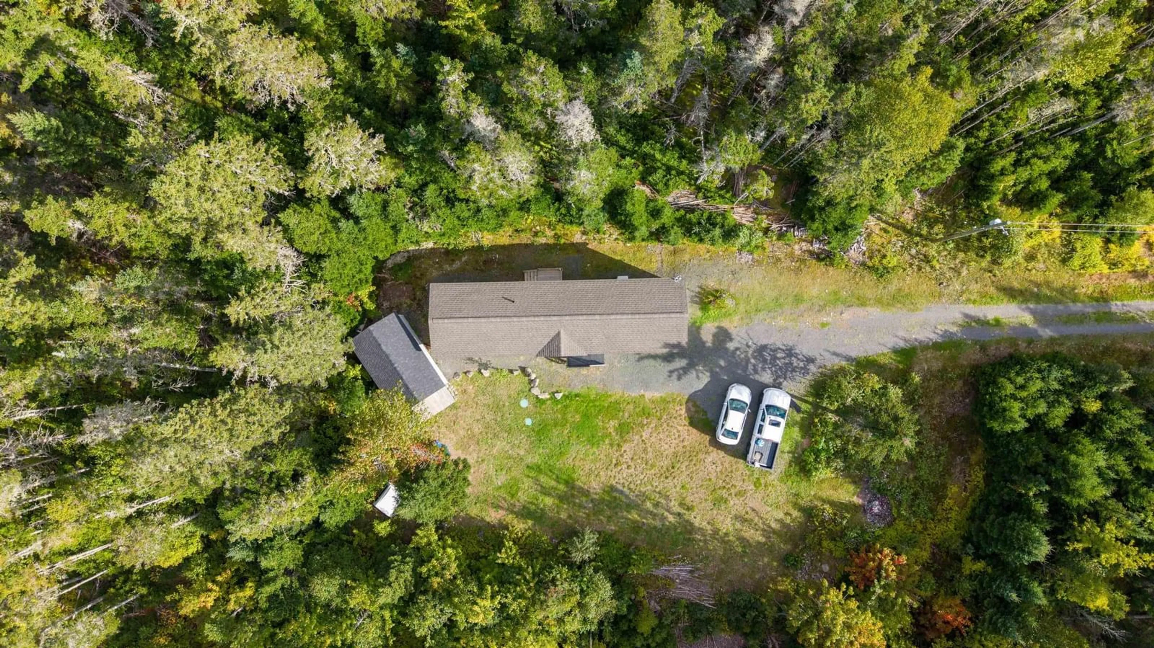 A pic from outside/outdoor area/front of a property/back of a property/a pic from drone, forest/trees view for 73 Church Rd, Ross Ferry Nova Scotia B0E 1B0