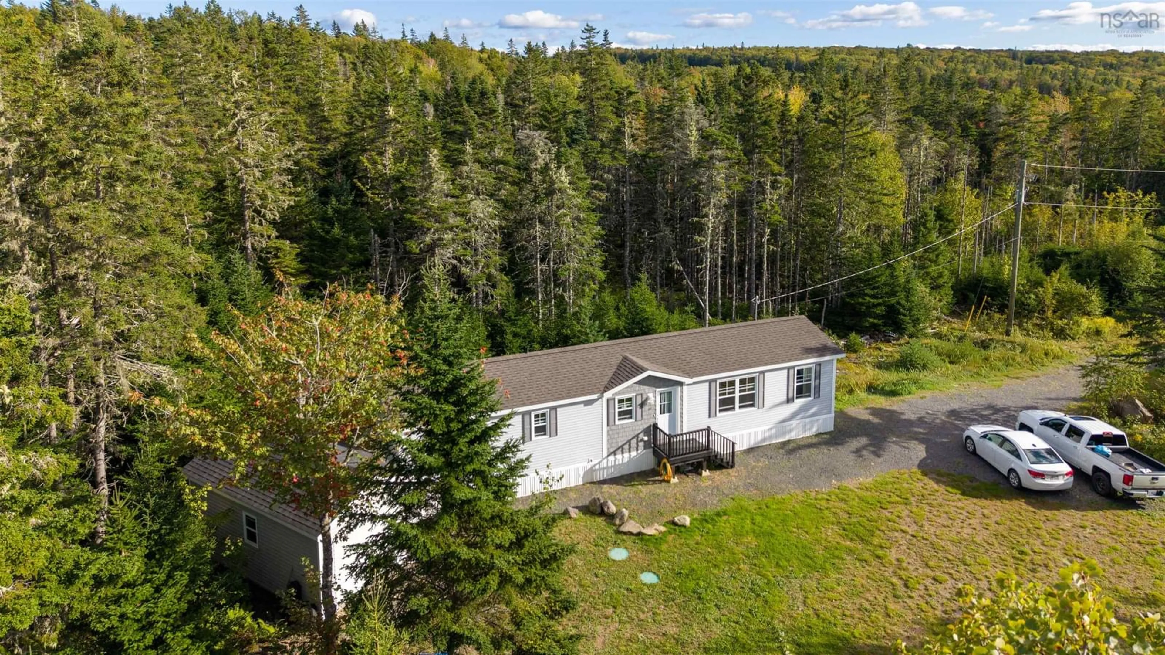 A pic from outside/outdoor area/front of a property/back of a property/a pic from drone, forest/trees view for 73 Church Rd, Ross Ferry Nova Scotia B0E 1B0