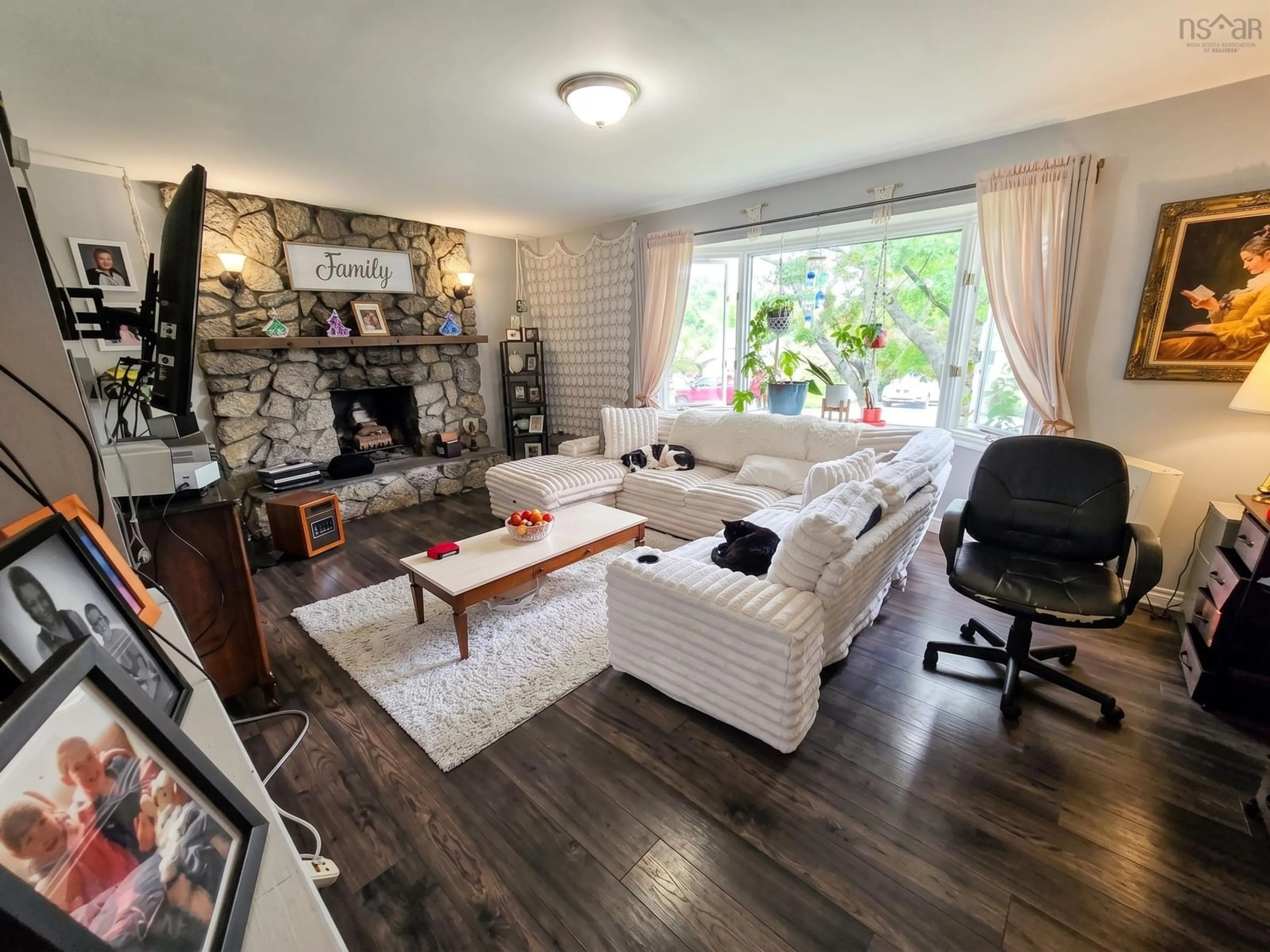 Living room with furniture, wood/laminate floor for 7 Haviland St, Lower Sackville Nova Scotia B4C 1Y8