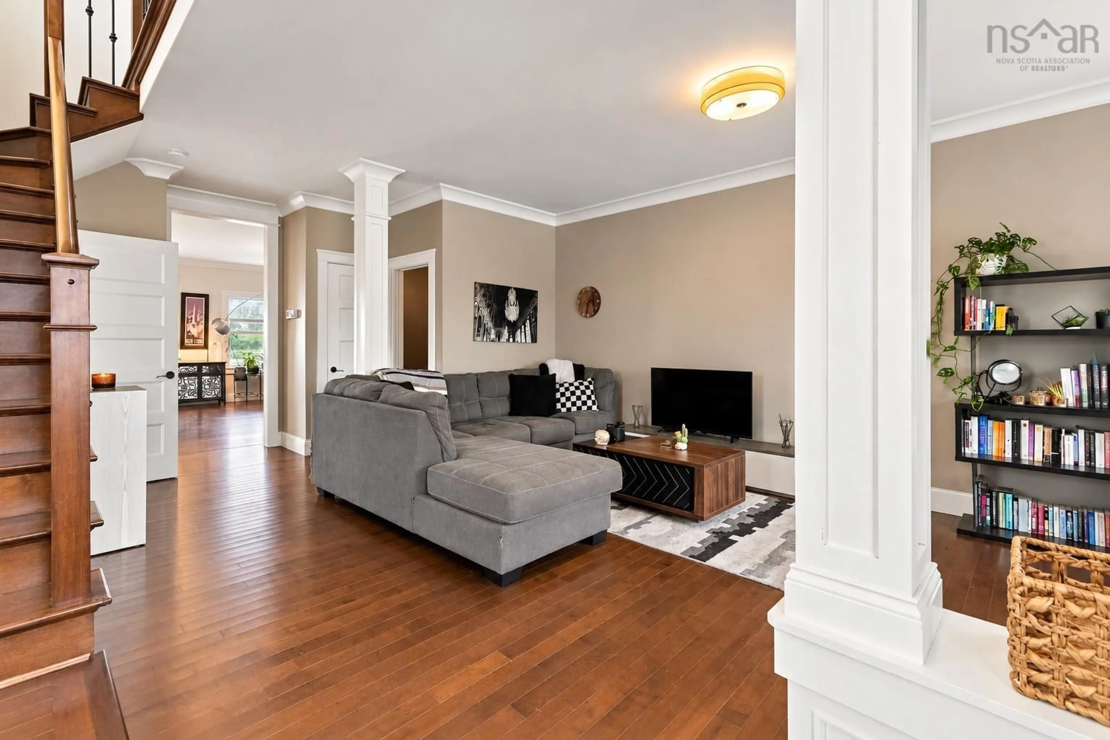 Living room with furniture, wood/laminate floor for 147 Maple Grove Ave, Timberlea Nova Scotia B3T 0C9