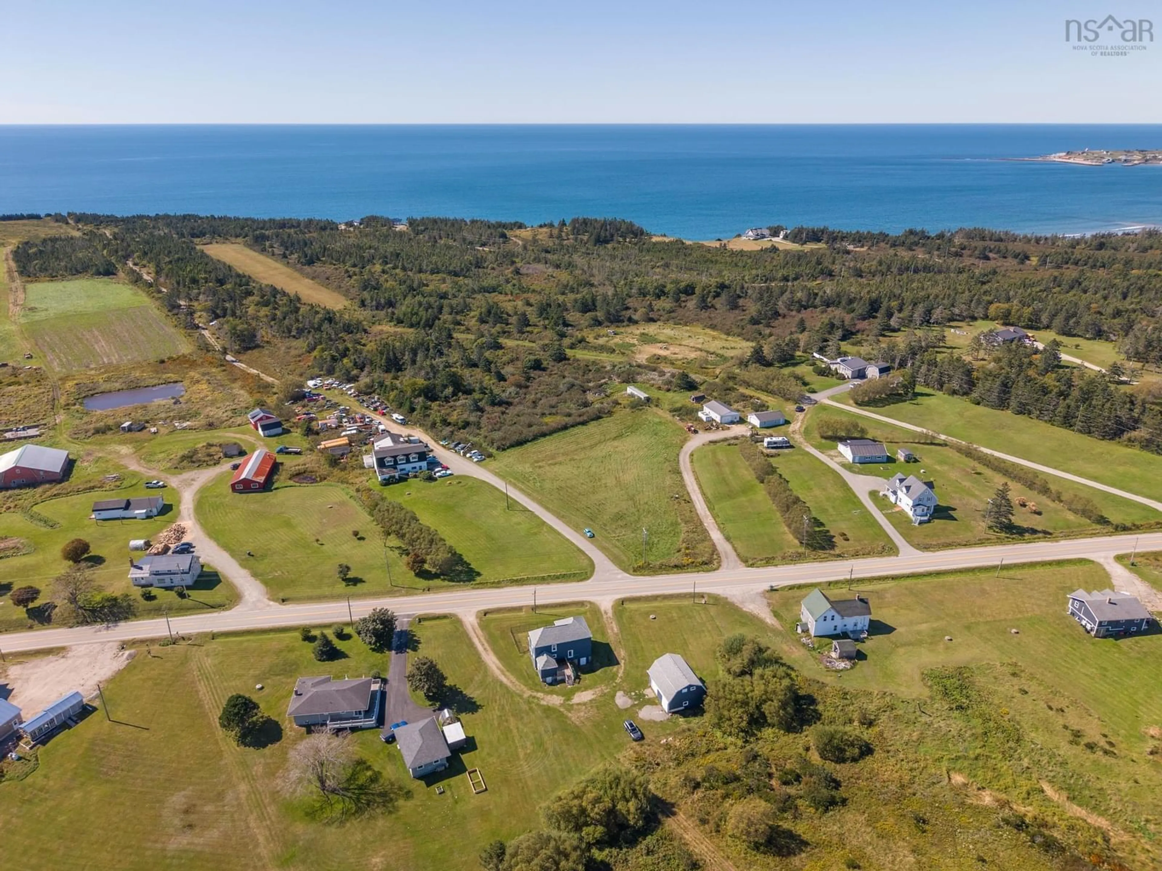 A pic from outside/outdoor area/front of a property/back of a property/a pic from drone, water/lake/river/ocean view for 5402 Highway 1, Salmon River Nova Scotia B5A 5B3