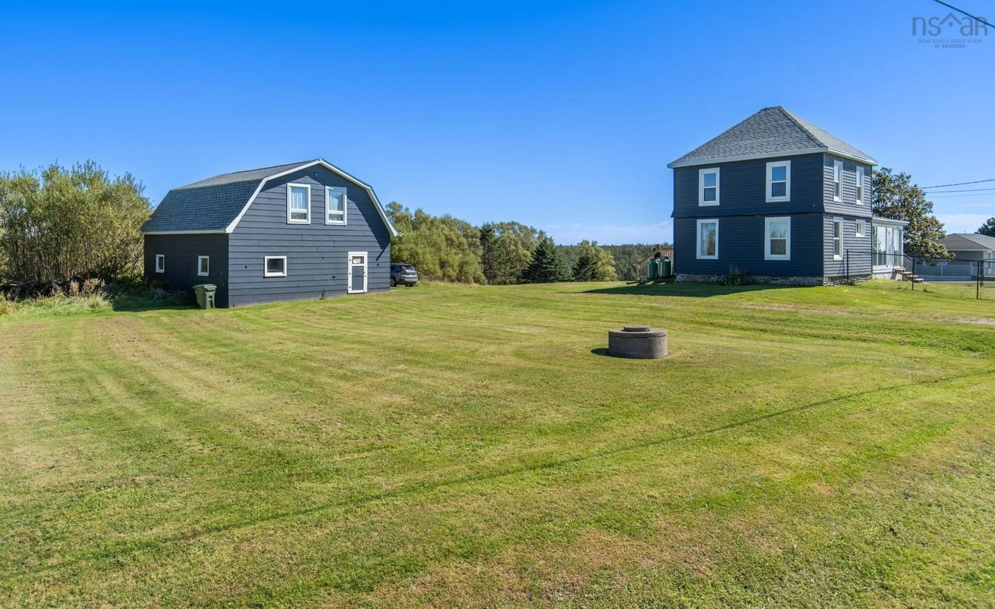 A pic from outside/outdoor area/front of a property/back of a property/a pic from drone, water/lake/river/ocean view for 5402 Highway 1, Salmon River Nova Scotia B5A 5B3