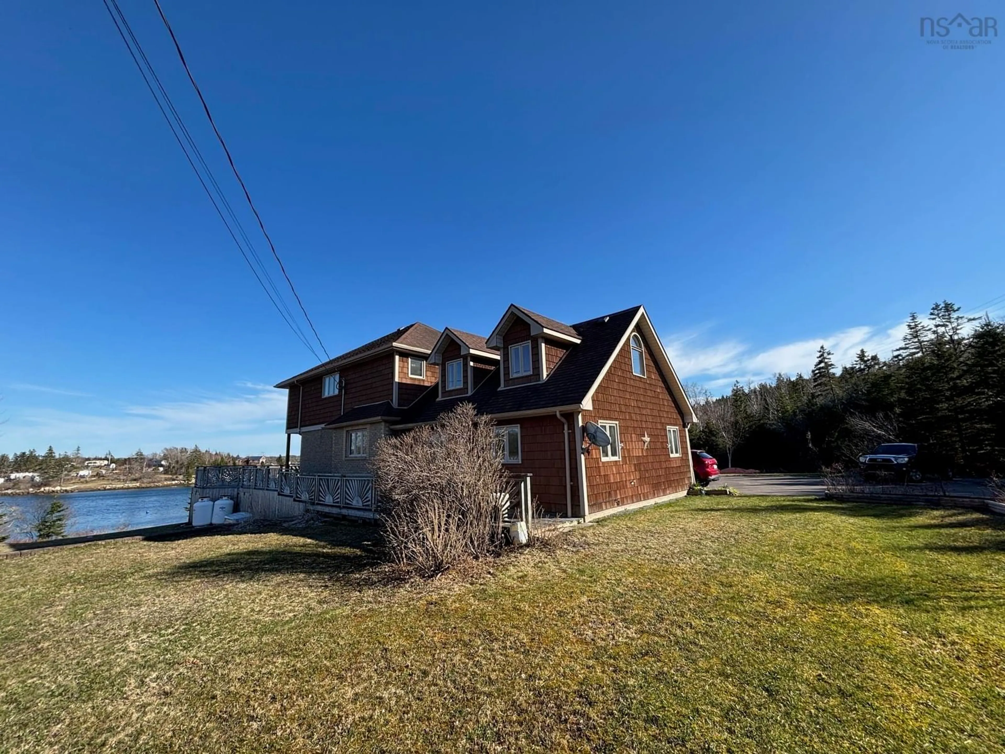 A pic from outside/outdoor area/front of a property/back of a property/a pic from drone, water/lake/river/ocean view for 18404 Highway 7, Popes Harbour Nova Scotia B0J 3H0