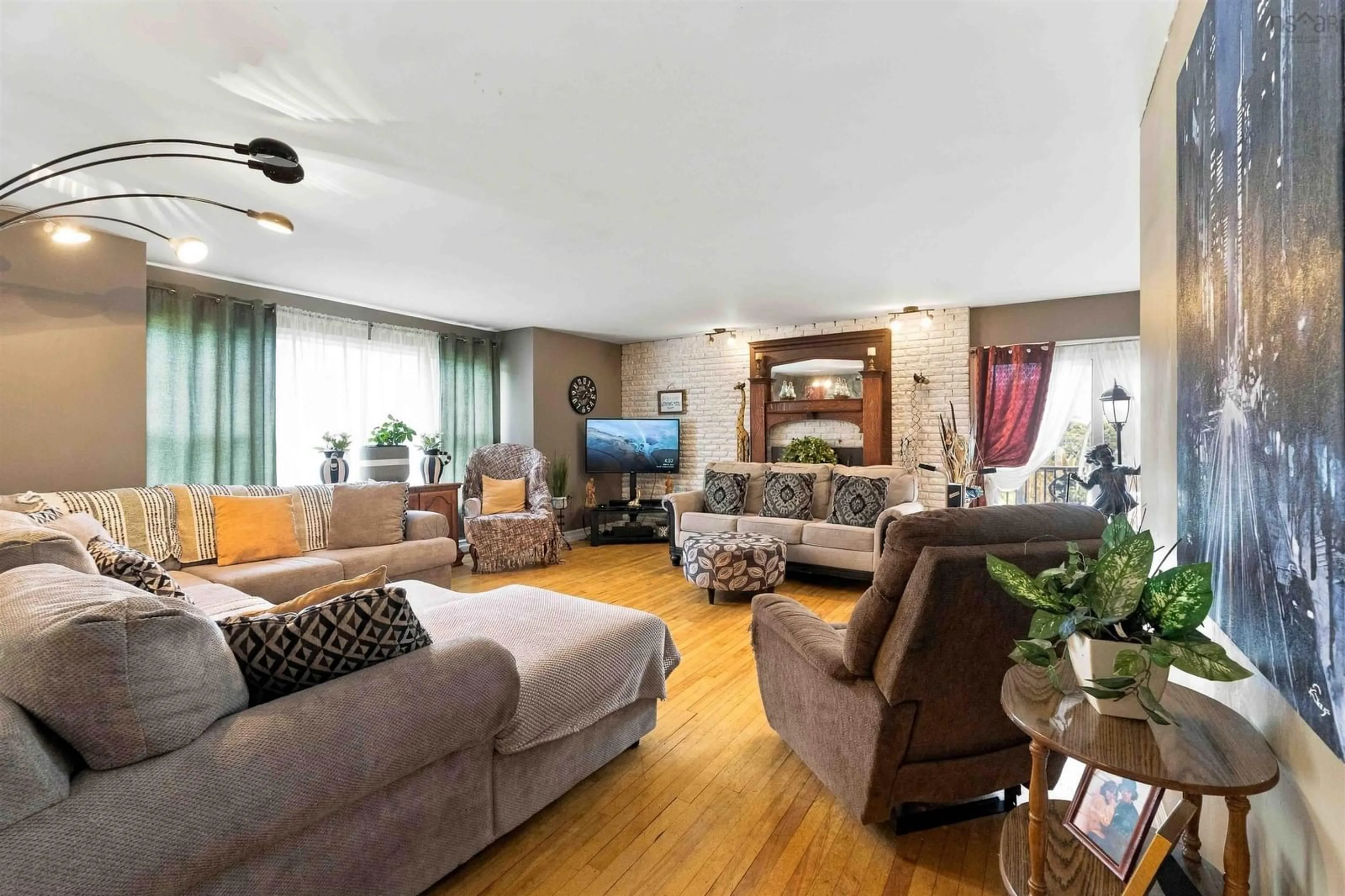 Living room with furniture, wood/laminate floor for 27 James St, Kentville Nova Scotia B4N 2A1