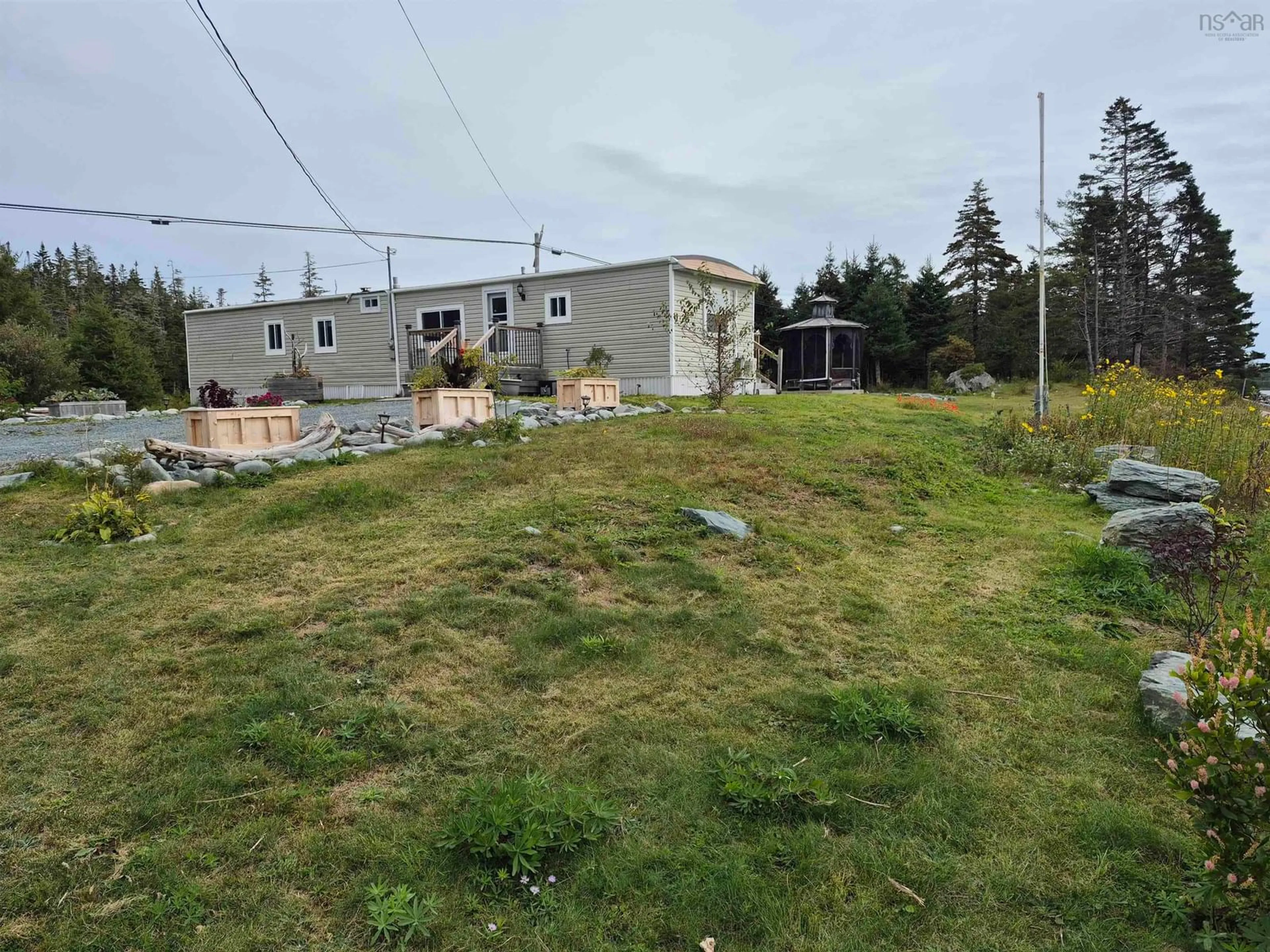 A pic from outside/outdoor area/front of a property/back of a property/a pic from drone, mountain view for 4639 7 Hwy, Liscomb Nova Scotia B0J 2A0