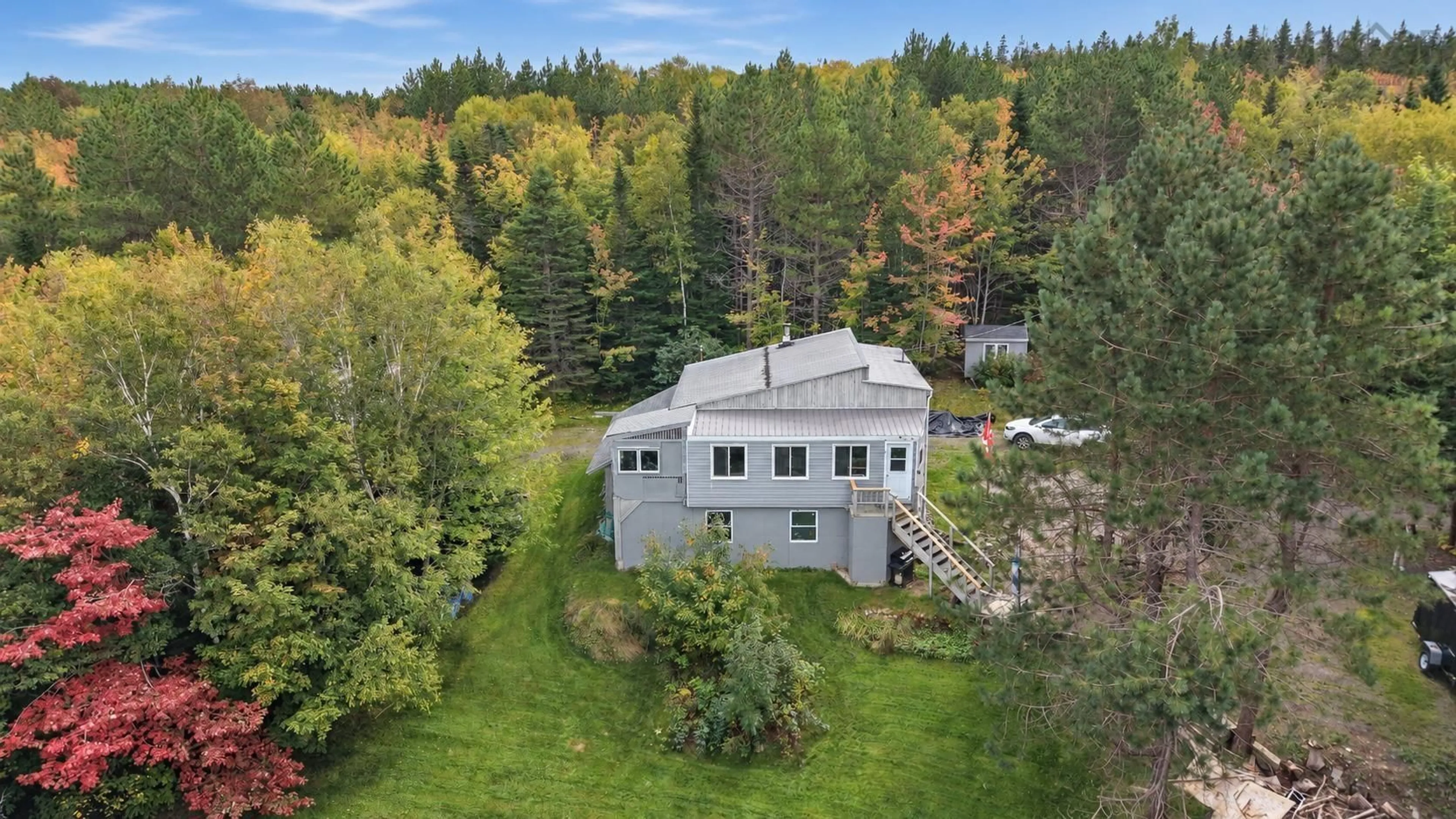 A pic from outside/outdoor area/front of a property/back of a property/a pic from drone, forest/trees view for 837 Meadow Rd, North River Nova Scotia B0E 1B0