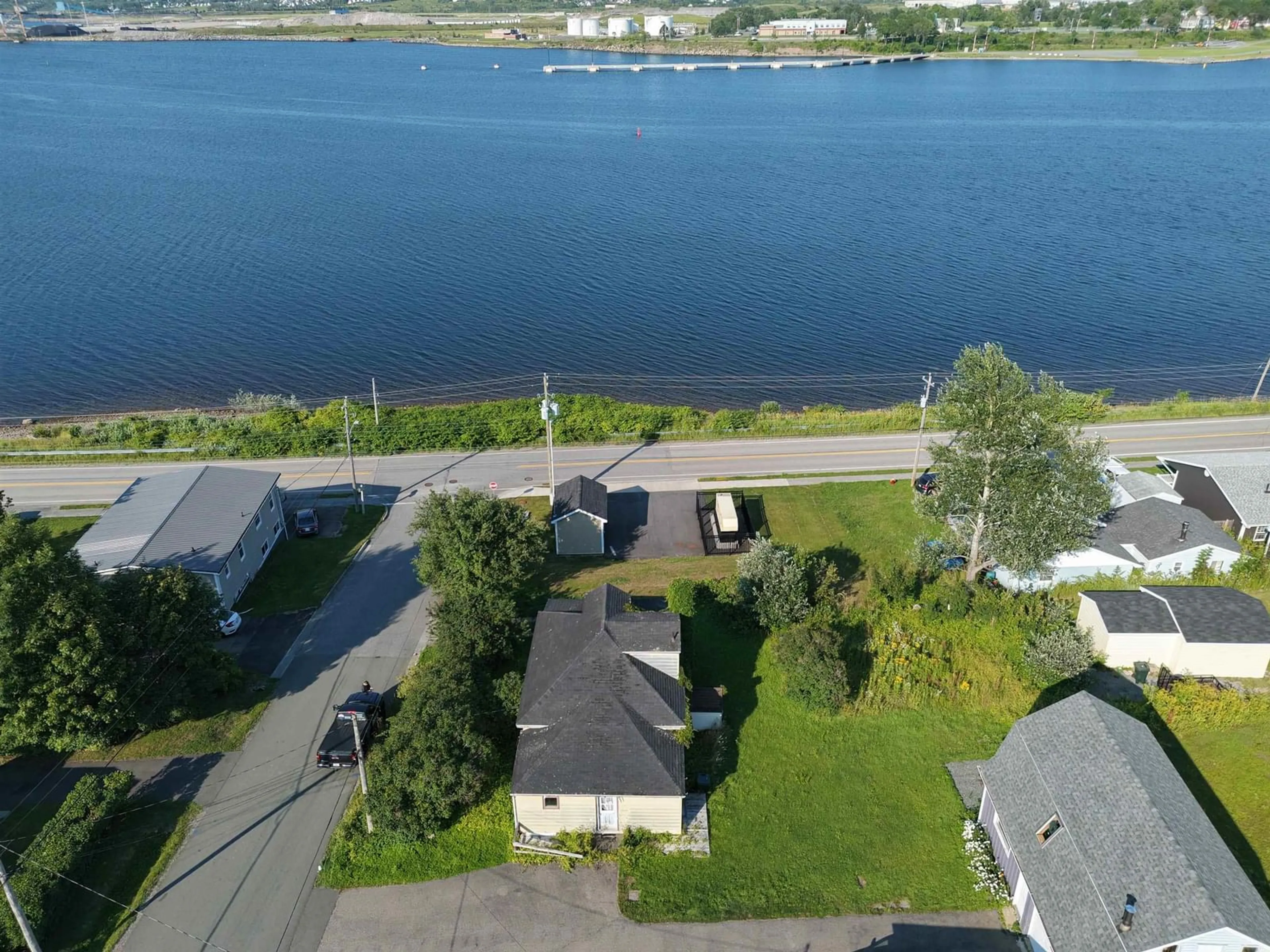 A pic from outside/outdoor area/front of a property/back of a property/a pic from drone, water/lake/river/ocean view for 7 Monteith Avenue, Westmount Nova Scotia B1R 1K3