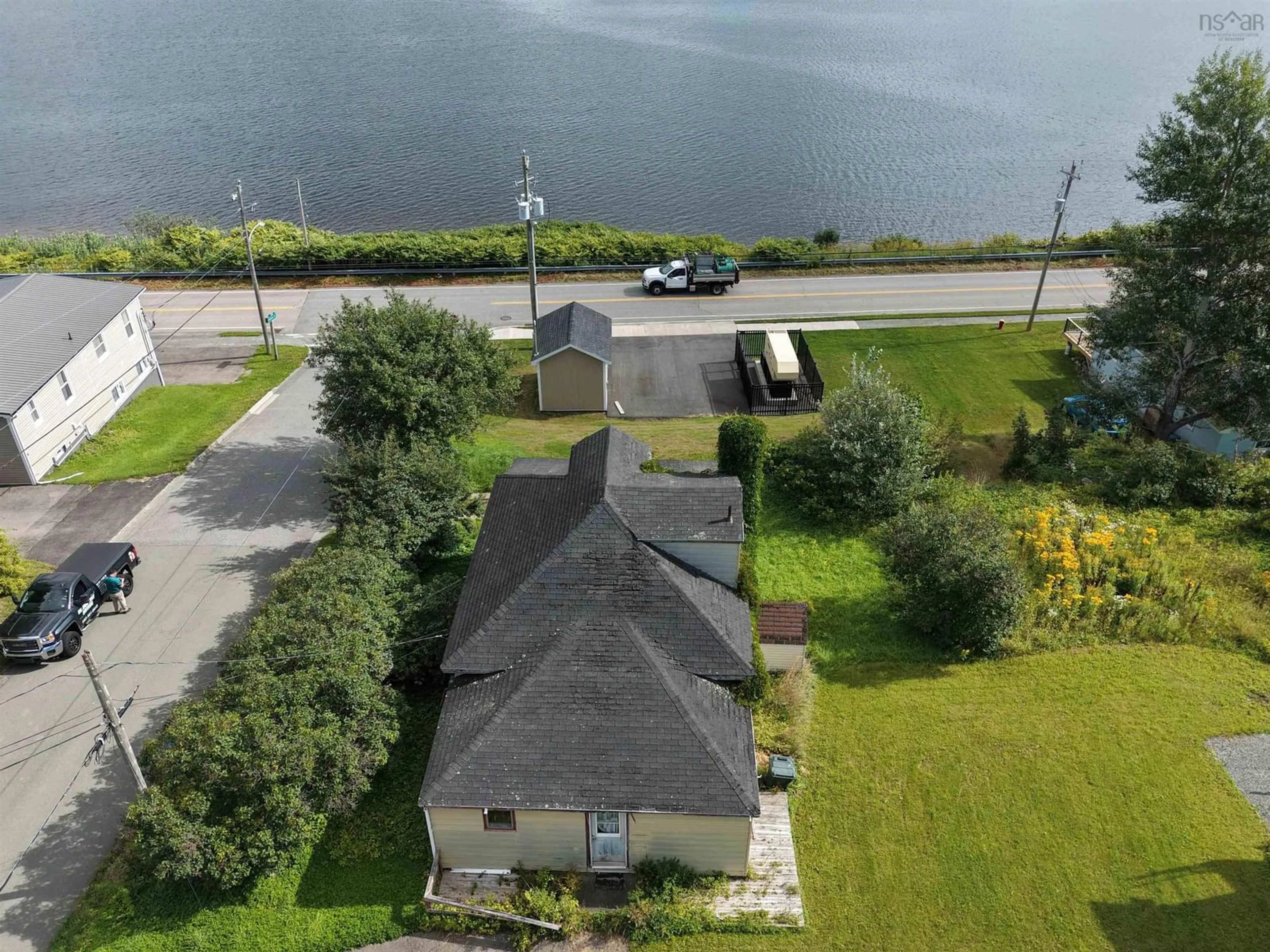 A pic from outside/outdoor area/front of a property/back of a property/a pic from drone, water/lake/river/ocean view for 7 Monteith Avenue, Westmount Nova Scotia B1R 1K3