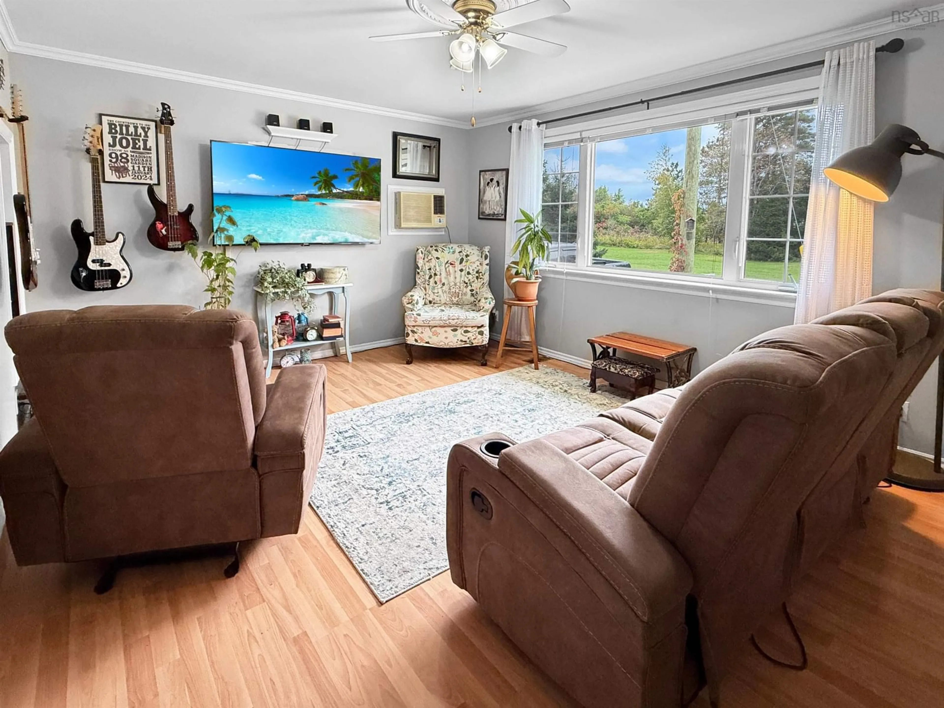 Living room with furniture, wood/laminate floor for 2092 Macquarrie Ave, Westville Nova Scotia B0K 2A0