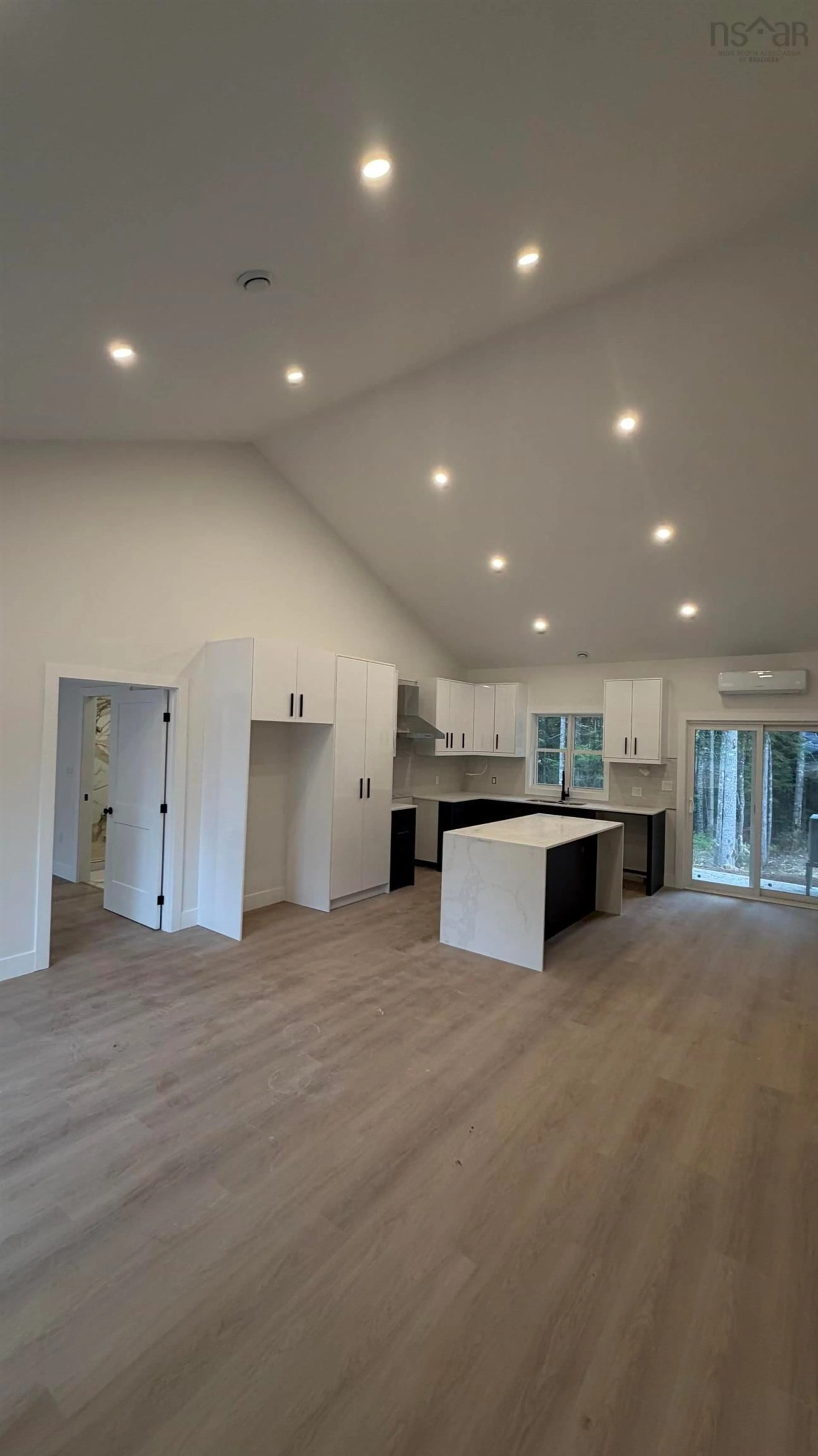 Open concept kitchen, wood/laminate floor for 83 Pinewood Dr, East Hants Nova Scotia B0N 1Z0