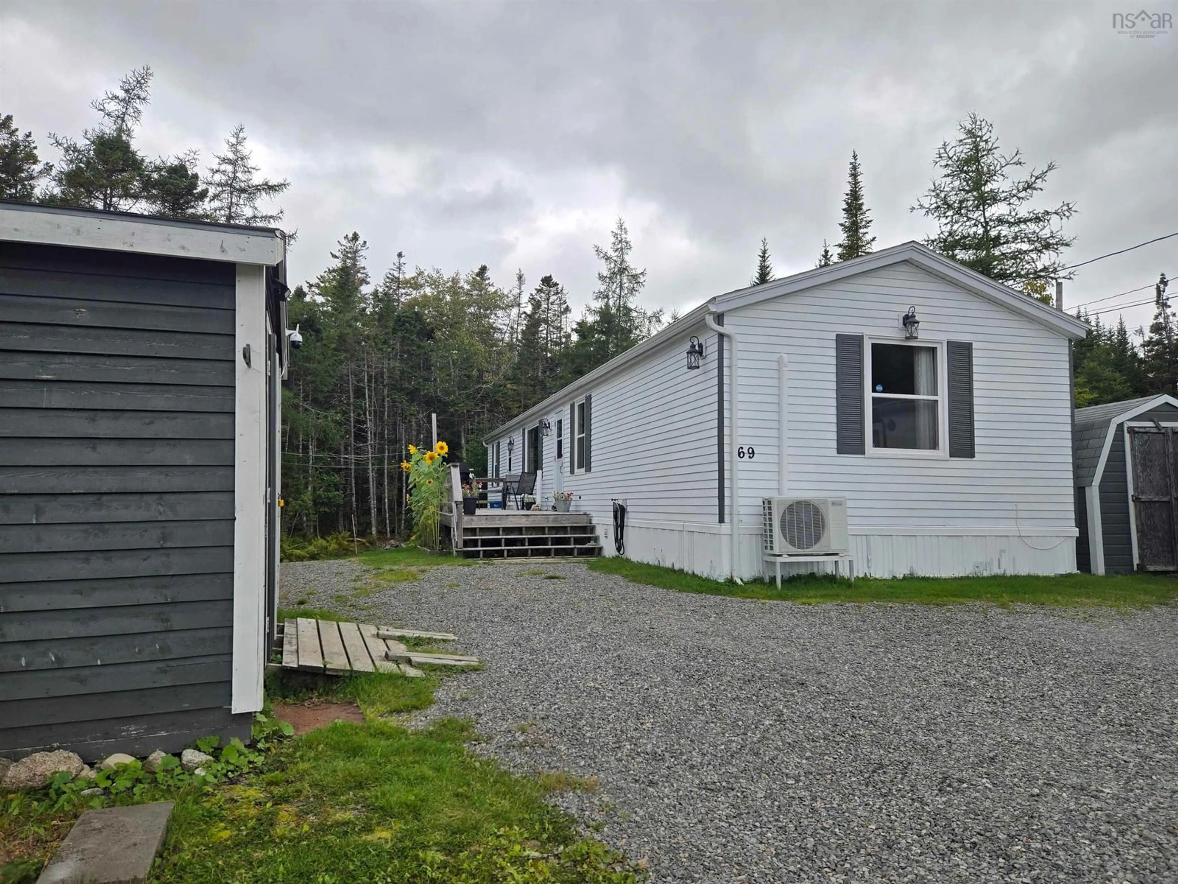 A pic from outside/outdoor area/front of a property/back of a property/a pic from drone, street for 69 De Raymond St, St. Peter's Nova Scotia B0E 3B0